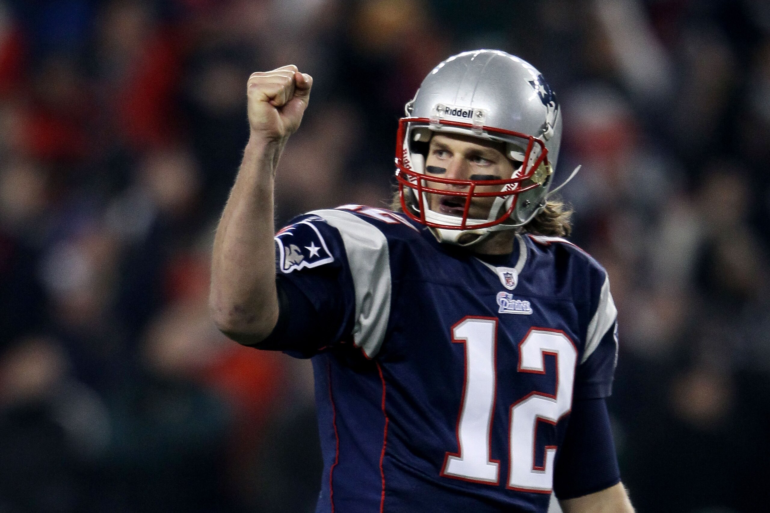 FOXBORO, MA - DECEMBER 19: Quarterback Tom Brady #12 of the New England Patriots celebrates a touchdown scored by running back BenJarvus Green-Ellis #42 (not pictured) against the Green Bay Packers in the first quarter of the game at Gillette Stadium on FOXBORO, MA - DECEMBER 19: Quarterback Tom Brady #12 of the New England Patriots celebrates a touchdown scored by running back BenJarvus Green-Ellis #42 (not pictured) against the Green Bay Packers in the first quarter of the game at Gillette Stadium on
