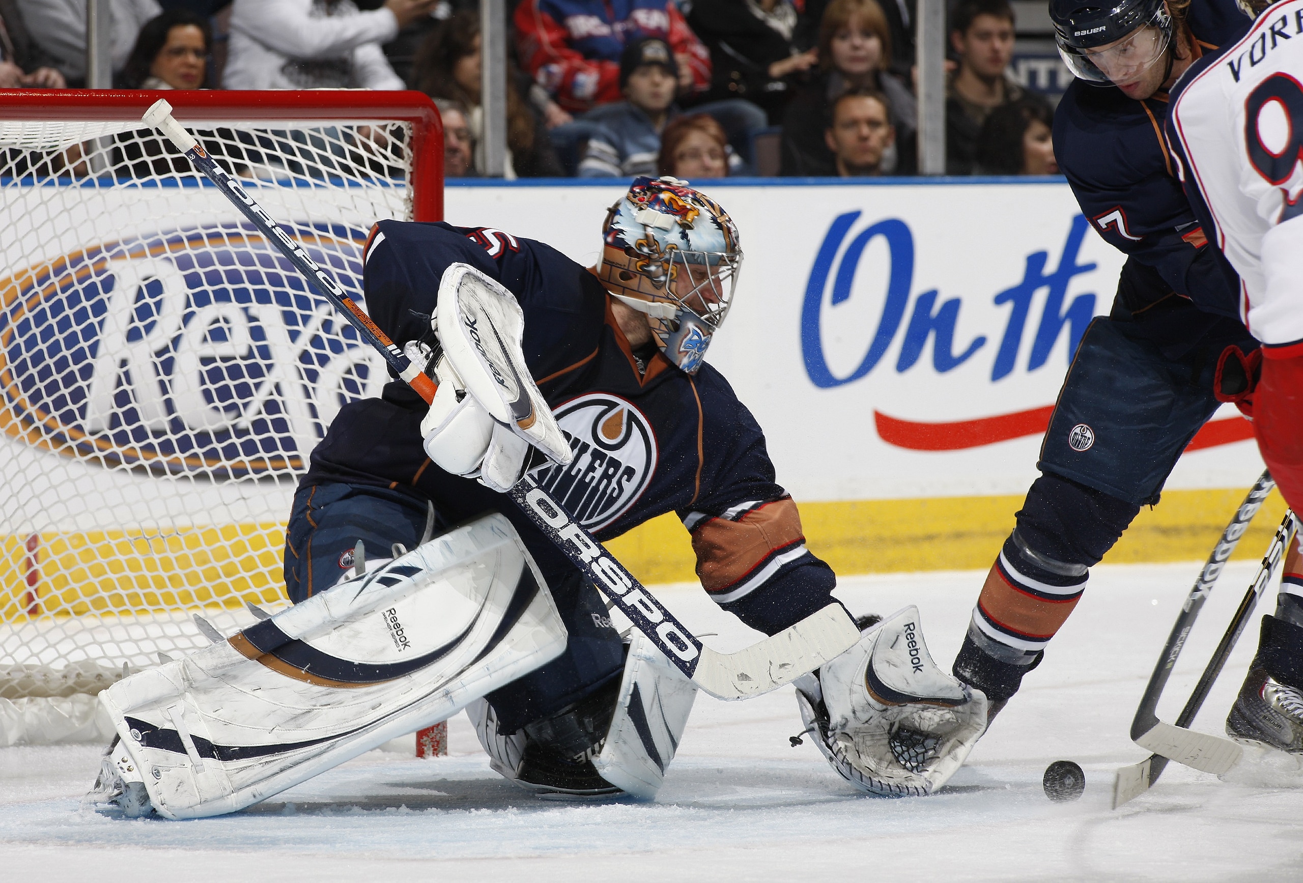 EDMONTON, CANADA - DECEMBER 16: Nikolai Khabibulin #35 of the Edmonton Oilers makes a save off Jakub Voracek #93 of the Columbus Blue Jackets at Rexall Place December 16, 2010 in Edmonton, Alberta, Canada. (Photo by Dale MacMillan/Getty Images)