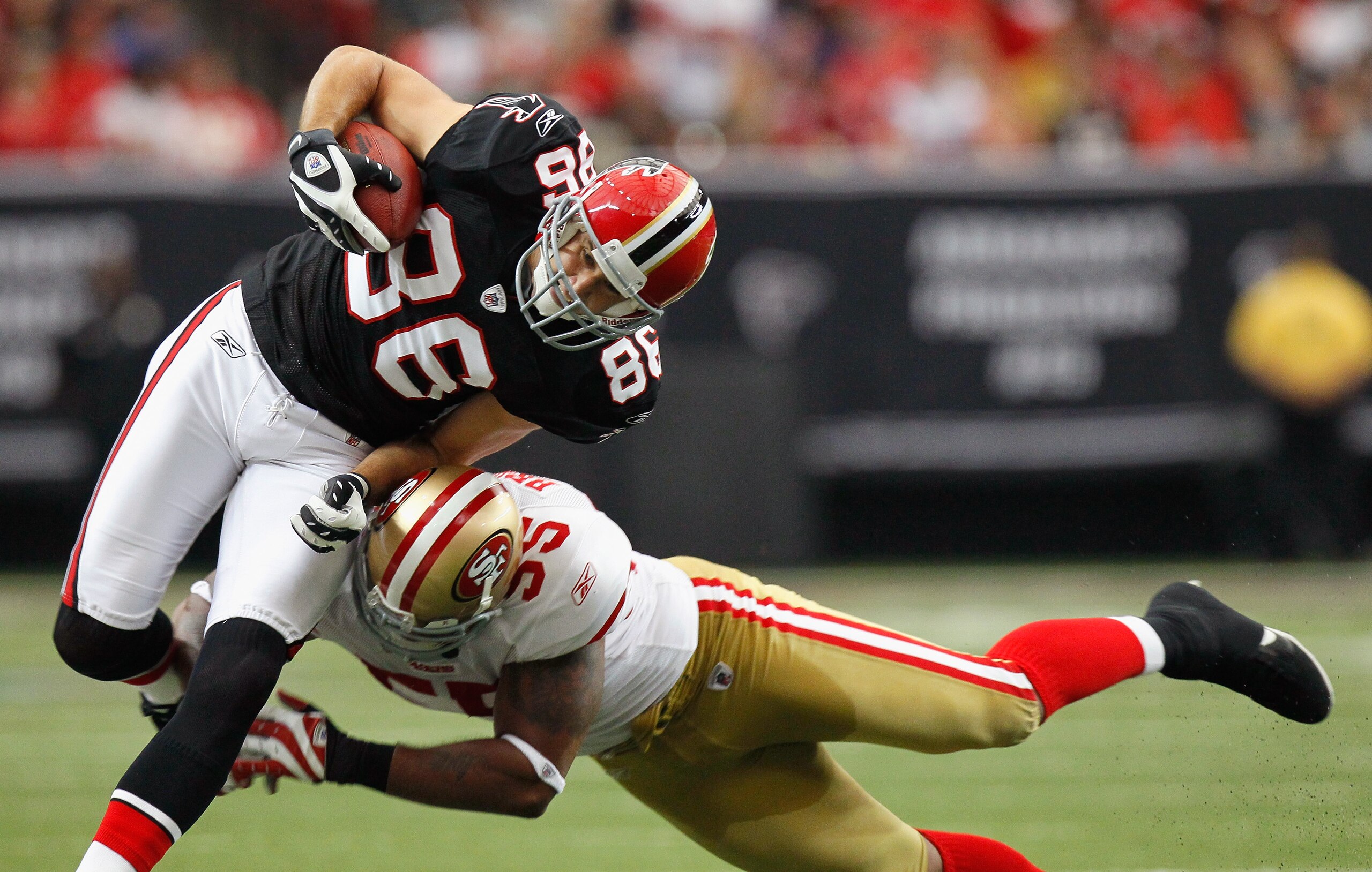ATLANTA - OCTOBER 03:  Brian Finneran #86 of the Atlanta Falcons is tackled by Ahmad Brooks #55 of the San Francisco 49ers at Georgia Dome on October 3, 2010 in Atlanta, Georgia.  (Photo by Kevin C. Cox/Getty Images)