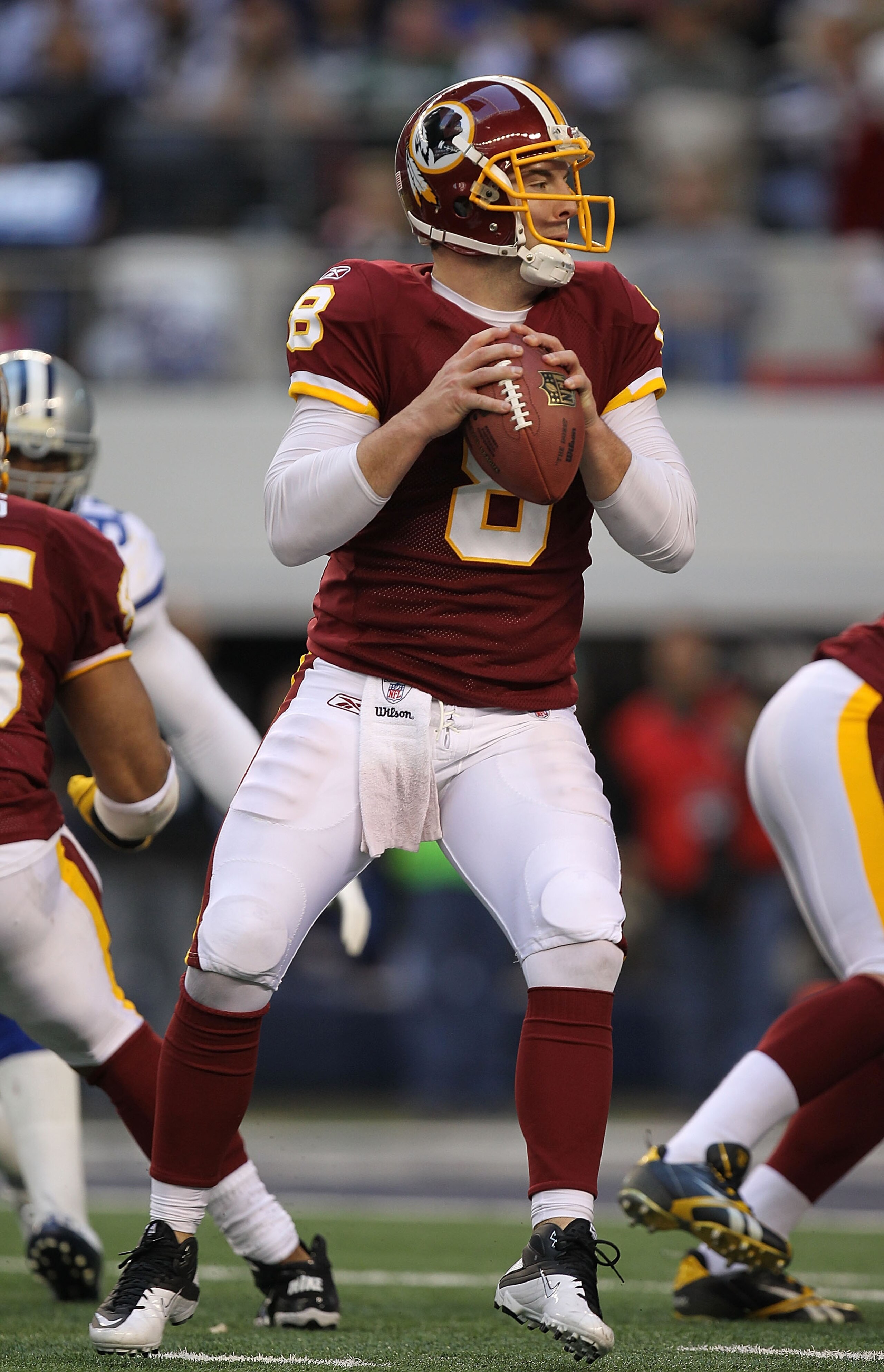 ARLINGTON, TX - DECEMBER 19:  Quarterback Rex Grossman #8 of the Washington Redskins passes against the Dallas Cowboys at Cowboys Stadium on December 19, 2010 in Arlington, Texas.  (Photo by Ronald Martinez/Getty Images)