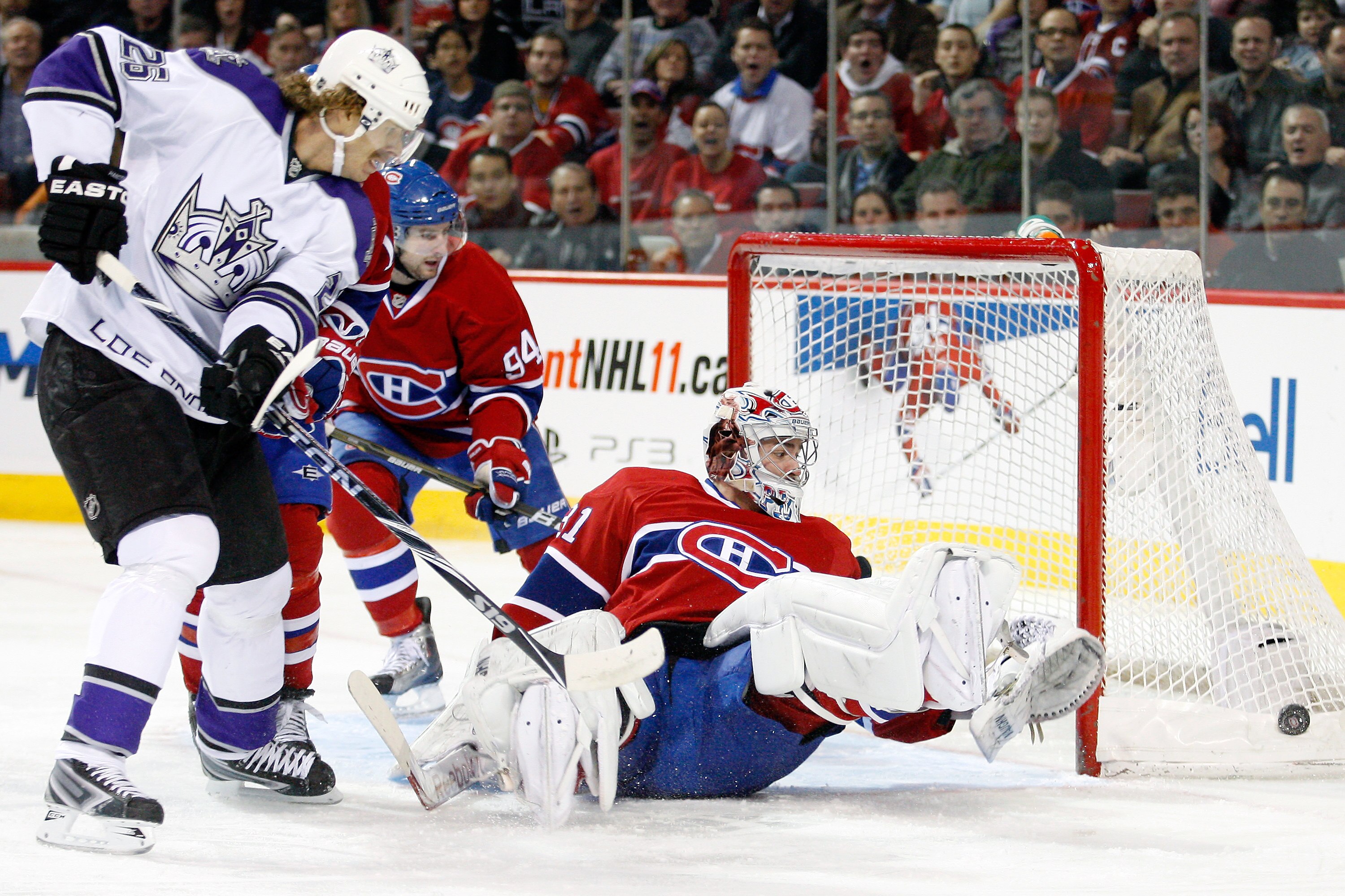 MONTREAL- NOVEMBER 24:  Carey Price #31 of the Montreal Canadiens stops the puck in front of Michal Handzus #26 of the Los Angeles Kings during the NHL game at the Bell Centre on November 24, 2010 in Montreal, Quebec, Canada.  (Photo by Richard Wolowicz/G