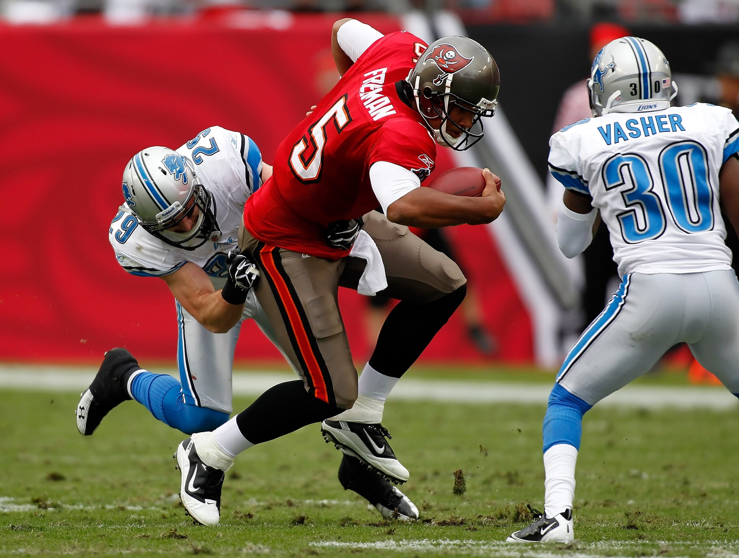 TAMPA, FL - DECEMBER 19:  Safety John Wendling #29 of the Detroit Lions tackles quarterback Josh Freeman #5 of the Tampa Bay Buccaneers during the game at Raymond James Stadium on December 19, 2010 in Tampa, Florida.  (Photo by J. Meric/Getty Images)