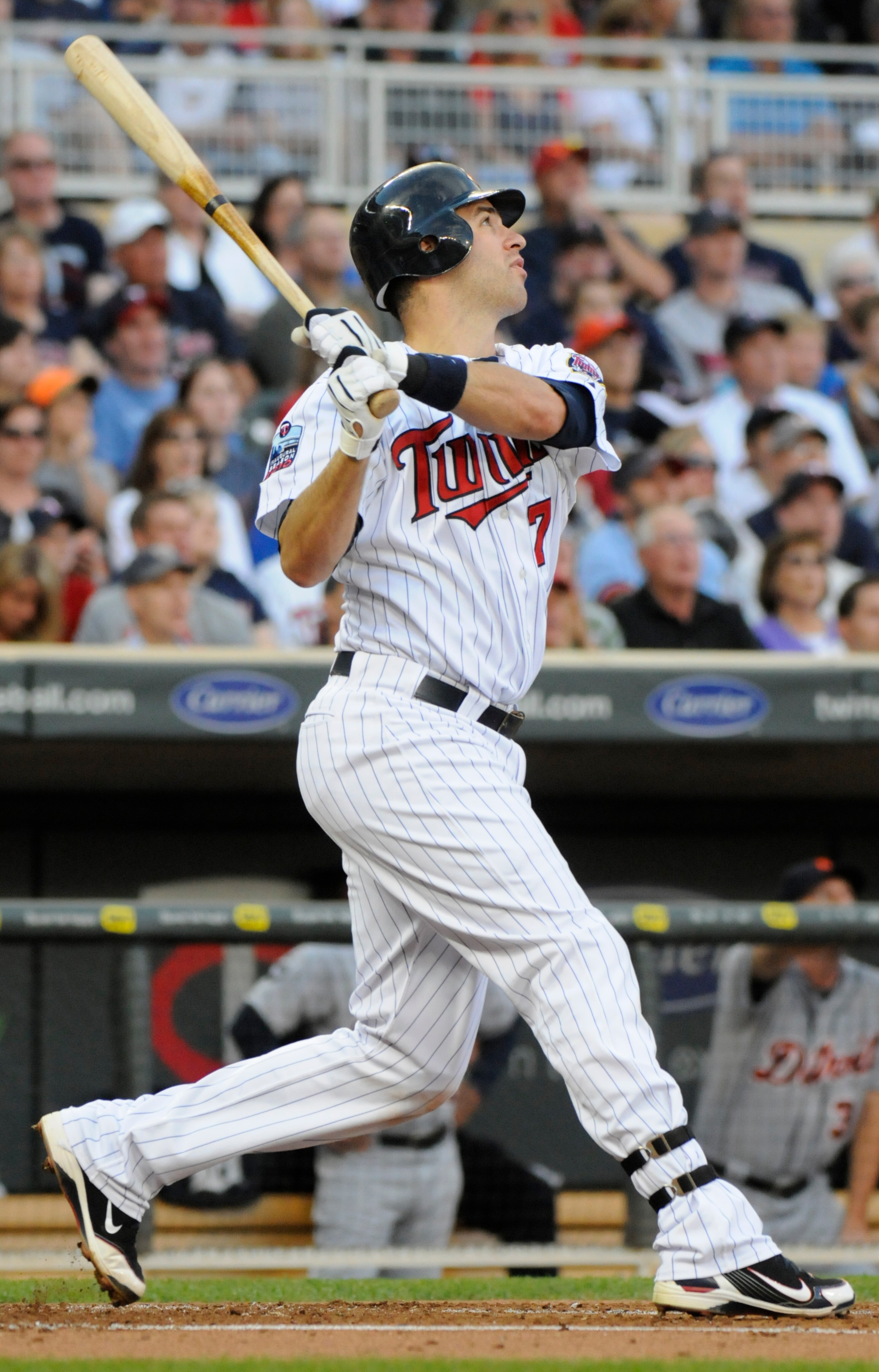 MINNEAPOLIS, MN - JUNE 28: Joe Mauer #7 of the Minnesota Twins hits a sacrifice fly in the first inning against the Detroit Tigers during their game on June 28, 2010 at Target Field in Minneapolis, Minnesota. Tigers won 7-5. (Photo by Hannah Foslien /Gett