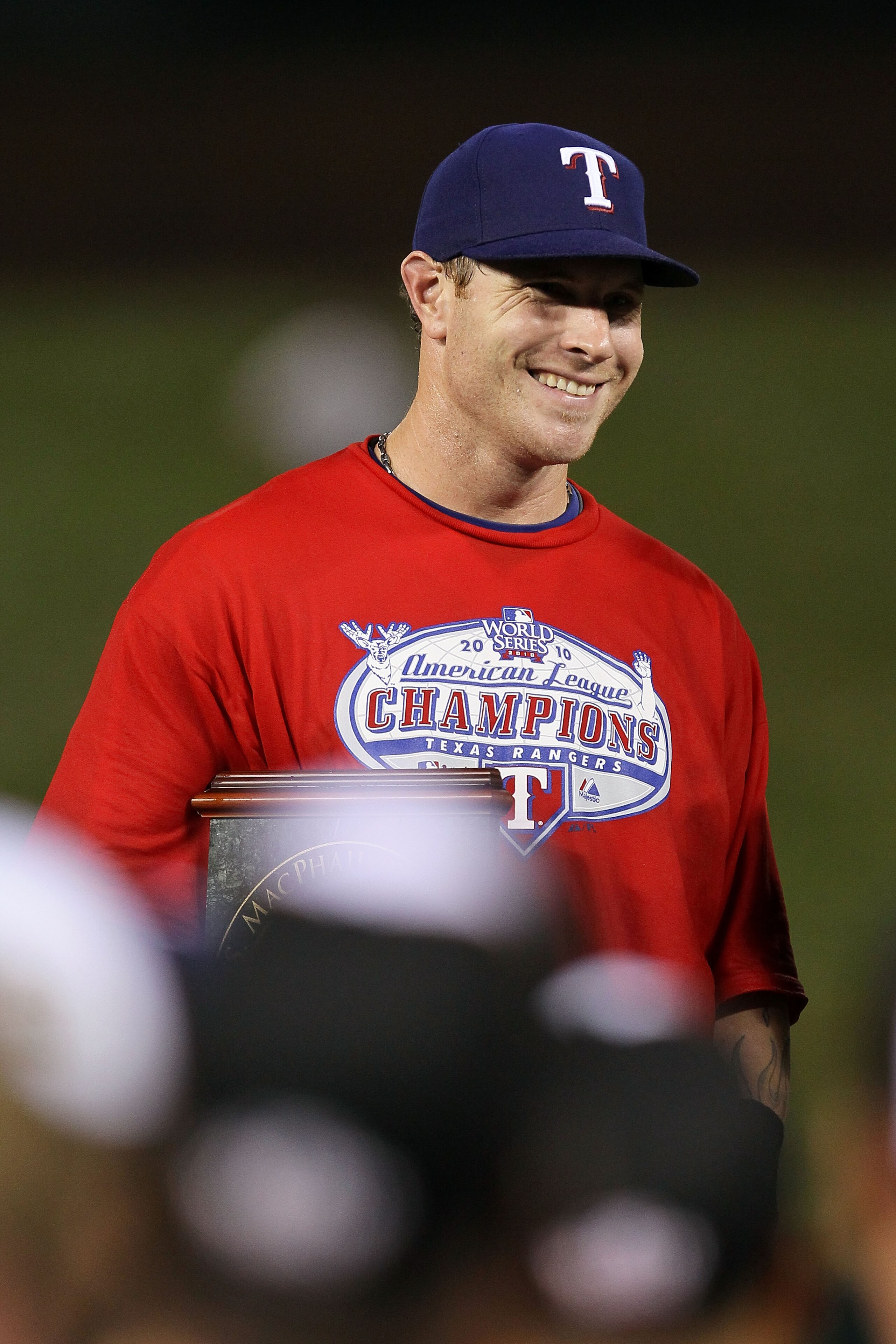 ARLINGTON, TX - OCTOBER 22:  Josh Hamilton #32 of the Texas Rangers celebrates with the AL championship series Most Valuable Player Award after defeating the New York Yankees 6-1 in Game Six of the ALCS to advance to the World Series during the 2010 MLB P