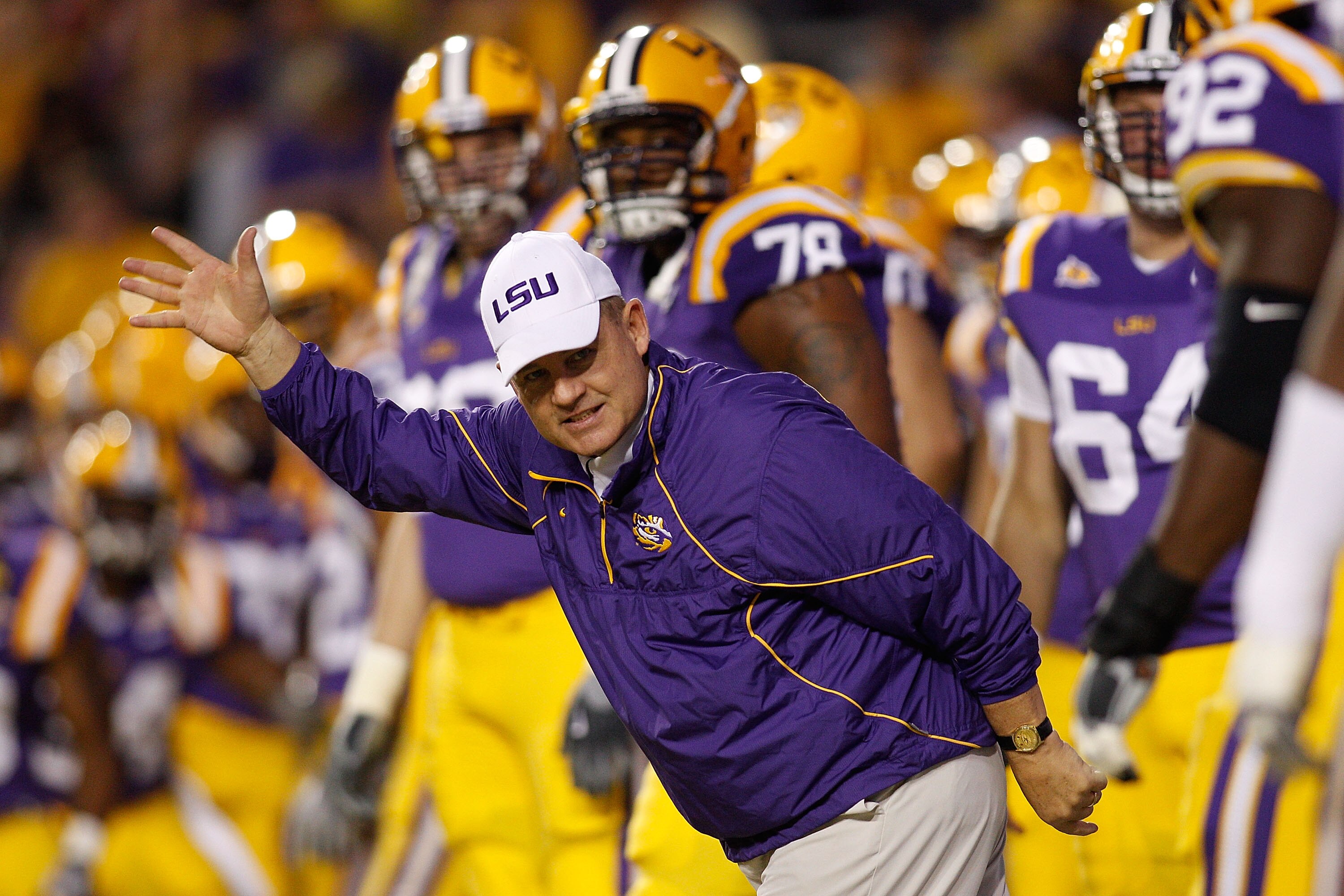 BATON ROUGE, LA - NOVEMBER 13:  Head coach Les Miles of the Louisiana State University Tigers runs on to the field during pregame before playing the  Louisiana Monroe Warhawks at Tiger Stadium on November 13, 2010 in Baton Rouge, Louisiana.  (Photo by Chr