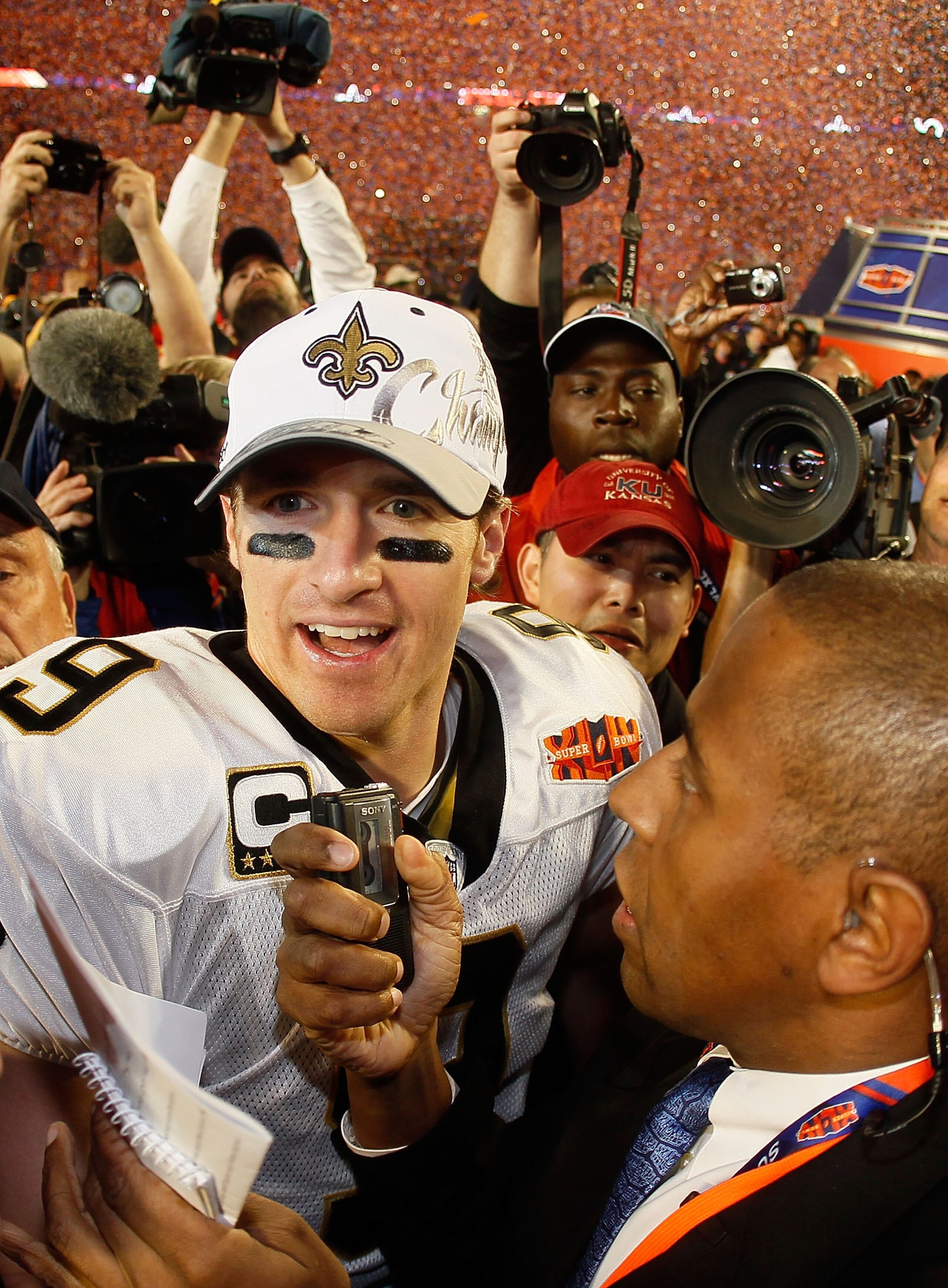 MIAMI GARDENS, FL - FEBRUARY 07:  Drew Brees #9 of the New Orleans Saints is interviewed on the field after his team defeated the Indianapolis Colts during Super Bowl XLIV on February 7, 2010 at Sun Life Stadium in Miami Gardens, Florida.  (Photo by Donal