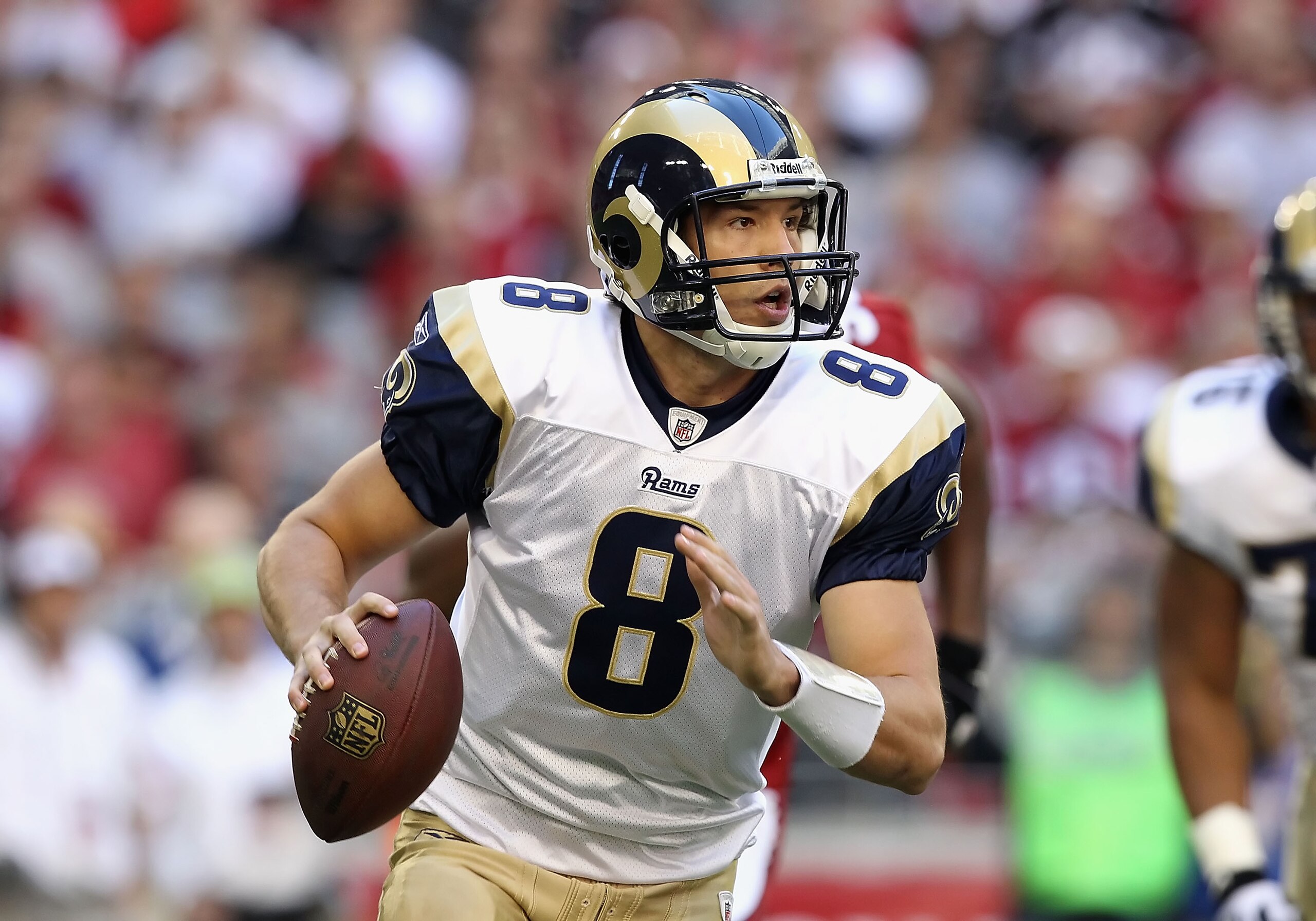 GLENDALE, AZ - DECEMBER 05: Quarterback Sam Bradford #8 of the St. Louis Rams scrambles to pass the football during the NFL game against the Arizona Cardinals at the University of Phoenix Stadium on December 5, 2010 in Glendale, Arizona. The Rams defeate GLENDALE, AZ - DECEMBER 05: Quarterback Sam Bradford #8 of the St. Louis Rams scrambles to pass the football during the NFL game against the Arizona Cardinals at the University of Phoenix Stadium on December 5, 2010 in Glendale, Arizona. The Rams defeate