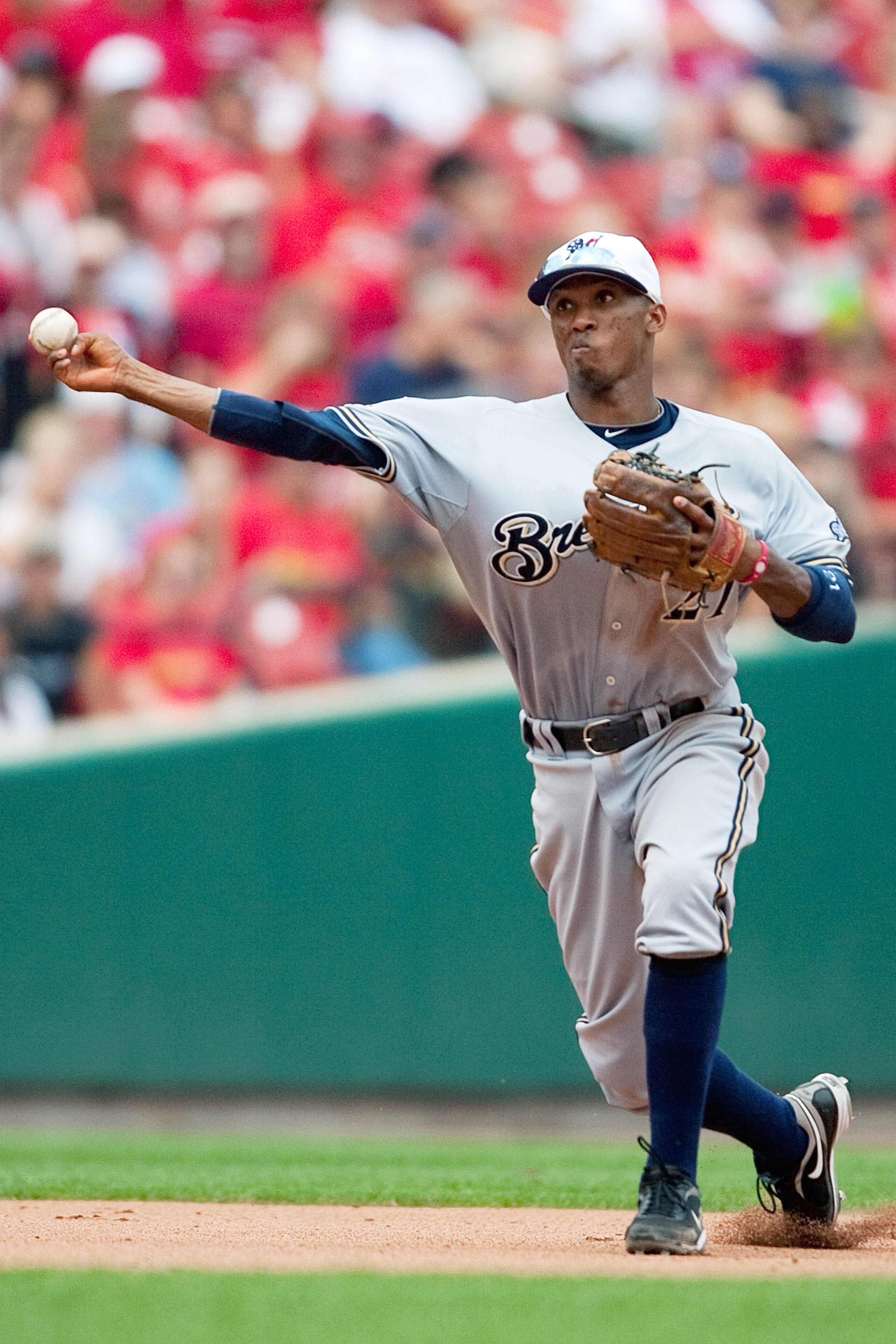 ST. LOUIS - JULY 4: Alcides Escobar #21 of the Milwaukee Brewers throws to first base against the St. Louis Cardinals at Busch Stadium on July 4, 2010 in St. Louis, Missouri. The Cardinals beat the Brewers 7-1. (Photo by Dilip Vishwanat/Getty Images) ST. LOUIS - JULY 4: Alcides Escobar #21 of the Milwaukee Brewers throws to first base against the St. Louis Cardinals at Busch Stadium on July 4, 2010 in St. Louis, Missouri. The Cardinals beat the Brewers 7-1. (Photo by Dilip Vishwanat/Getty Images)