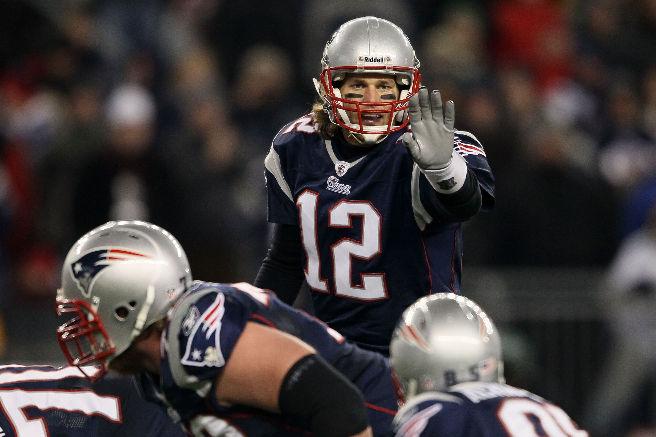 FOXBORO, MA - DECEMBER 19: Quarterback Tom Brady #12 of the New England Patriots talks to his team during the fourth quarter of the game against the Green Bay Packers at Gillette Stadium on December 19, 2010 in Foxboro, Massachusetts. The Patriots won th FOXBORO, MA - DECEMBER 19: Quarterback Tom Brady #12 of the New England Patriots talks to his team during the fourth quarter of the game against the Green Bay Packers at Gillette Stadium on December 19, 2010 in Foxboro, Massachusetts. The Patriots won th