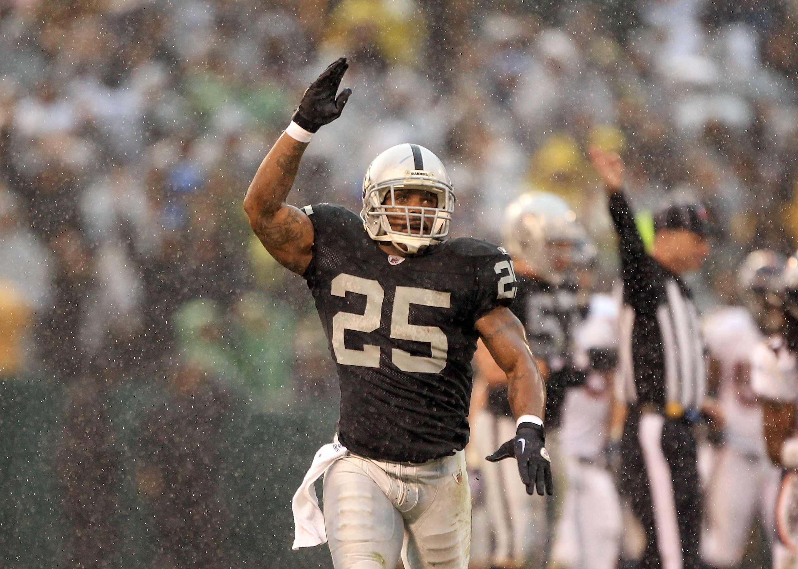 OAKLAND, CA - DECEMBER 19: Rock Cartwright #25 celebrates after Hiram Eugene #31 of the Oakland Raiders recovers a fumble by7 Syd'Quan Thompson #22 of the Denver Broncos at Oakland-Alameda County Coliseum on December 19, 2010 in Oakland, California. (Ph OAKLAND, CA - DECEMBER 19: Rock Cartwright #25 celebrates after Hiram Eugene #31 of the Oakland Raiders recovers a fumble by7 Syd'Quan Thompson #22 of the Denver Broncos at Oakland-Alameda County Coliseum on December 19, 2010 in Oakland, California. (Ph