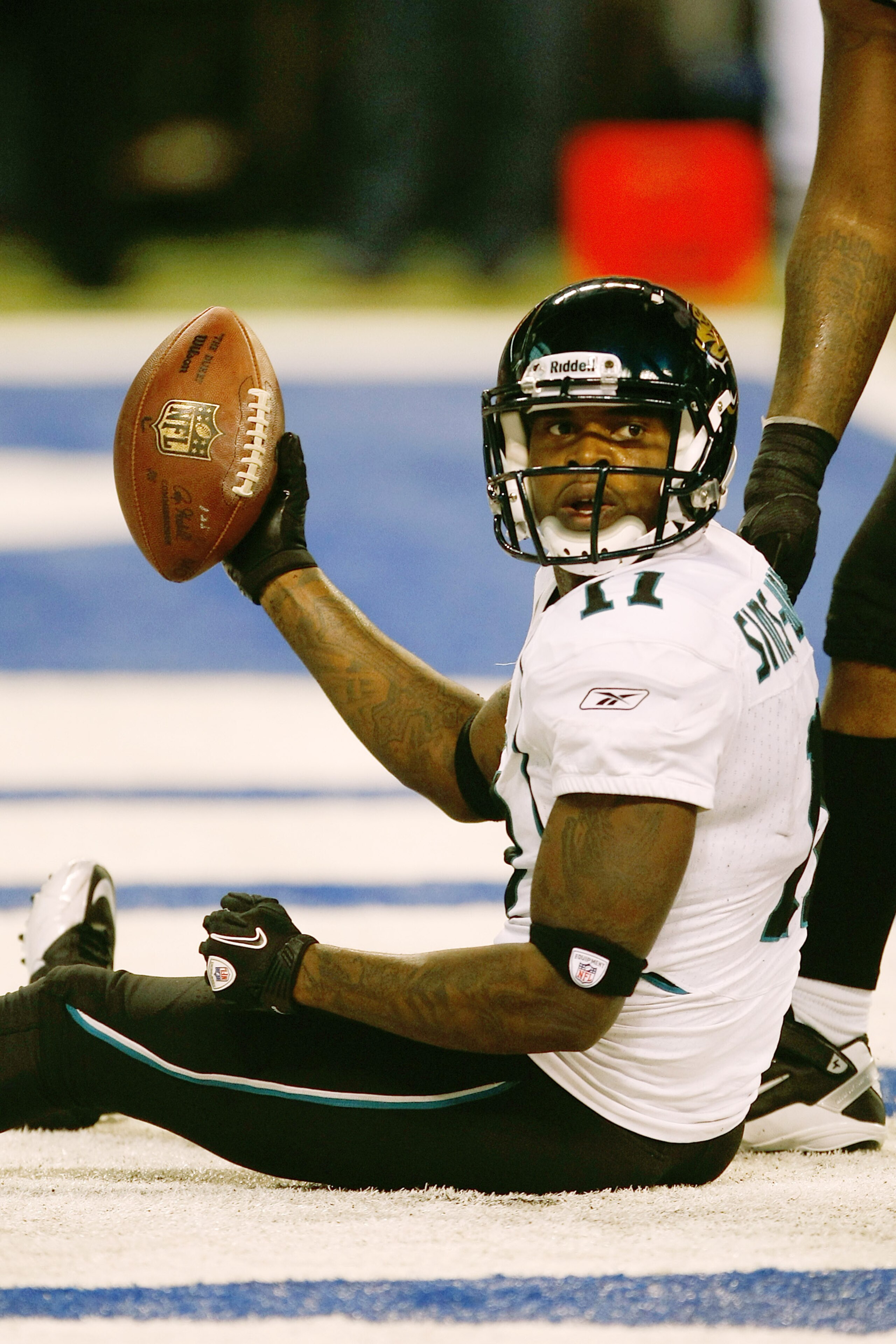 INDIANAPOLIS, IN - DECEMBER 19: Mike Sims-Walker #11 of the Jacksonville Jaguars holds up the football after scoring a touchdown against the Indianapolis Colts at Lucas Oil Stadium on December 19, 2010 in Indianapolis, Indiana. The Colts defeated the Jagu INDIANAPOLIS, IN - DECEMBER 19: Mike Sims-Walker #11 of the Jacksonville Jaguars holds up the football after scoring a touchdown against the Indianapolis Colts at Lucas Oil Stadium on December 19, 2010 in Indianapolis, Indiana. The Colts defeated the Jagu