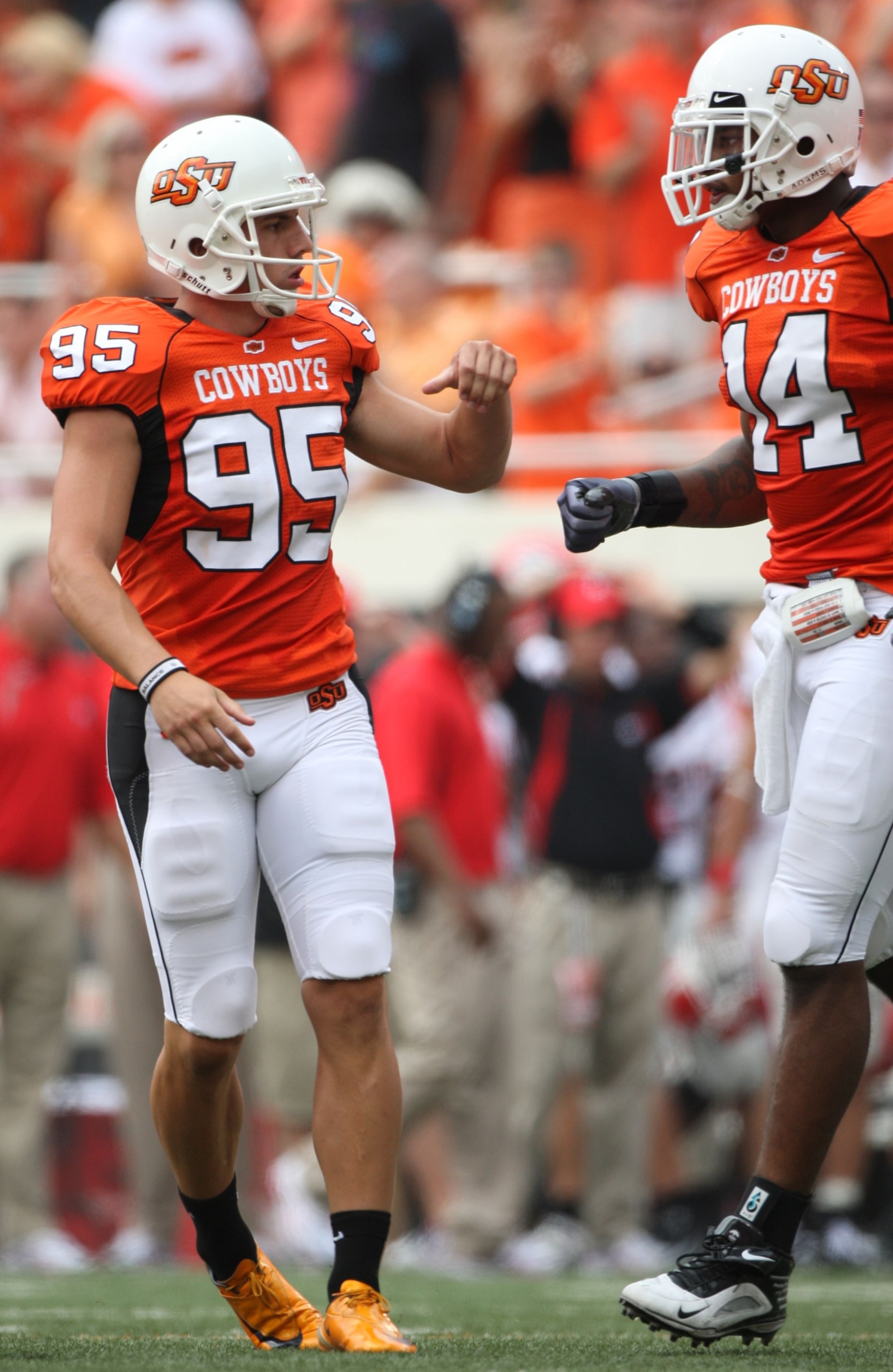 STILLWATER, OK - SEPTEMBER 5: Kicker Dan Bailey #95 of the Oklahoma State Cowboys is congratulated by teammate tight end Justin Horton #14 after Bailey kicked a field goal against the Georgia Bulldogs in the second quarter of the game at Boone Pickens Sta