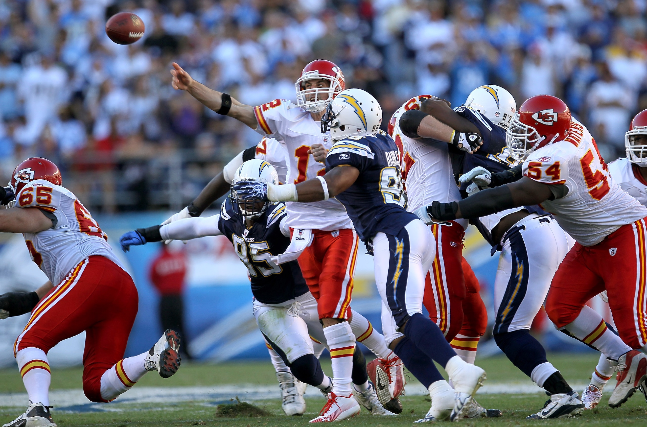 SAN DIEGO - DECEMBER 12:  Quarterback Brodie Croyle #12 of the Kansas City Chiefs throws a pass under pressue from linebacker Antwan Barnes #98 of the San Diego Chargers at Qualcomm Stadium on December 12, 2010 in San Diego, California.  The Chargers won