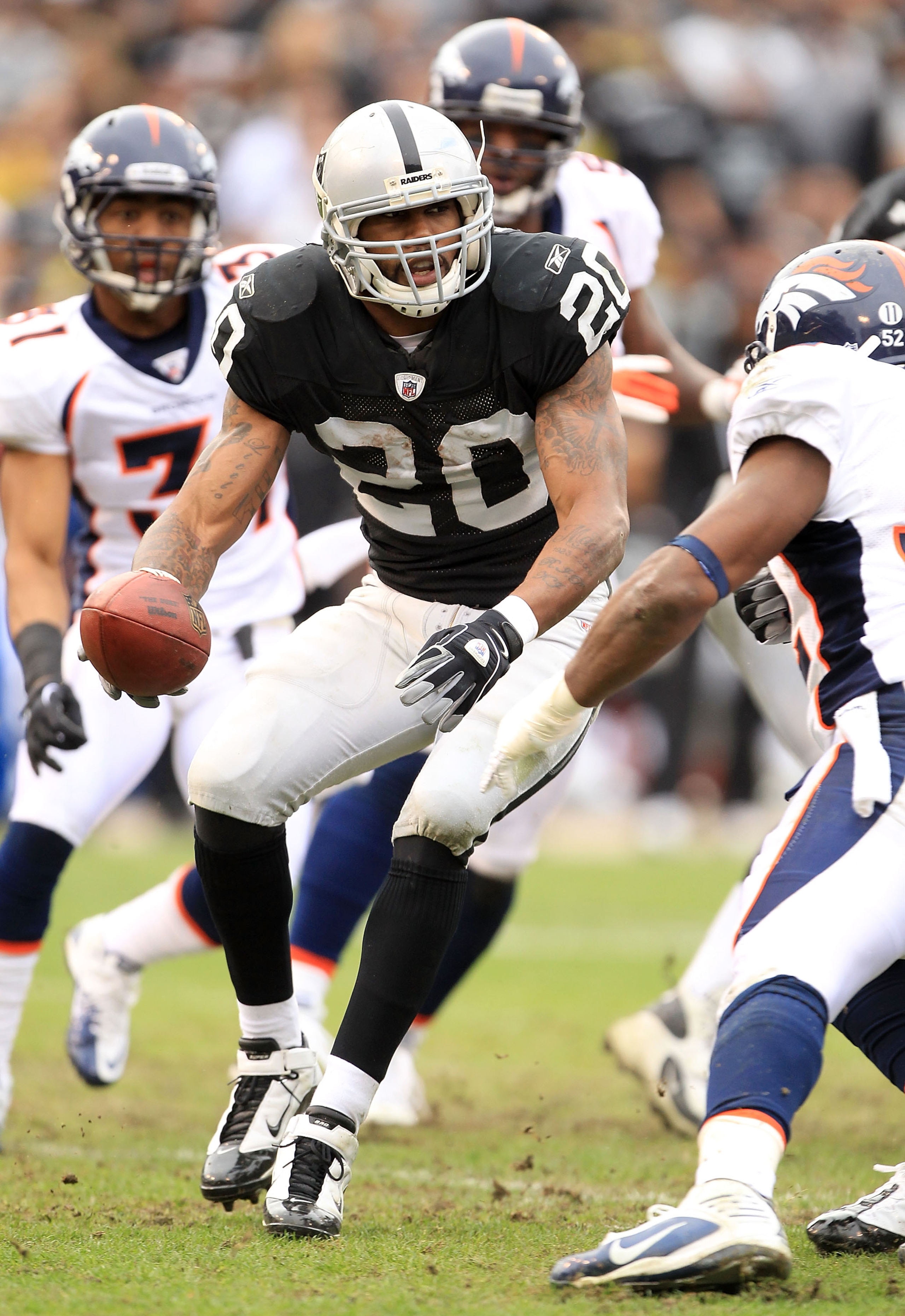 OAKLAND, CA - DECEMBER 19:  Darren McFadden #20 of the Oakland Raiders runs with the ball during their game against the Denver Broncos at Oakland-Alameda County Coliseum on December 19, 2010 in Oakland, California.  (Photo by Ezra Shaw/Getty Images)