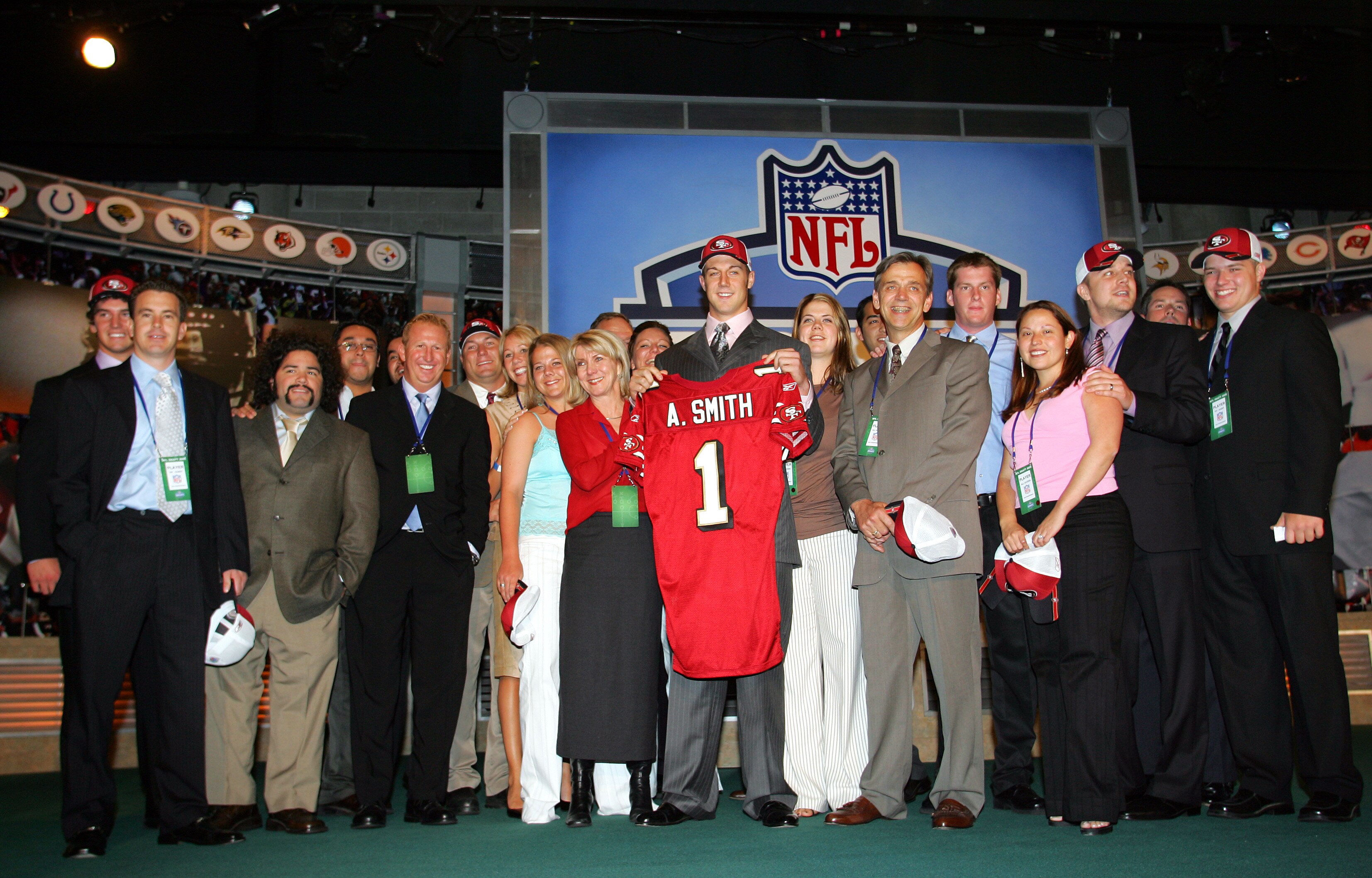 NEW YORK - APRIL 23:  Quarterback Alex Smith (C) (Utah), drafted first overall by the San Francisco 49ers, poses with his family during the 70th NFL Draft on April 23, 2005 at the Jacob K. Javits Convention Center in New York City.  (Photo by Chris Trotma