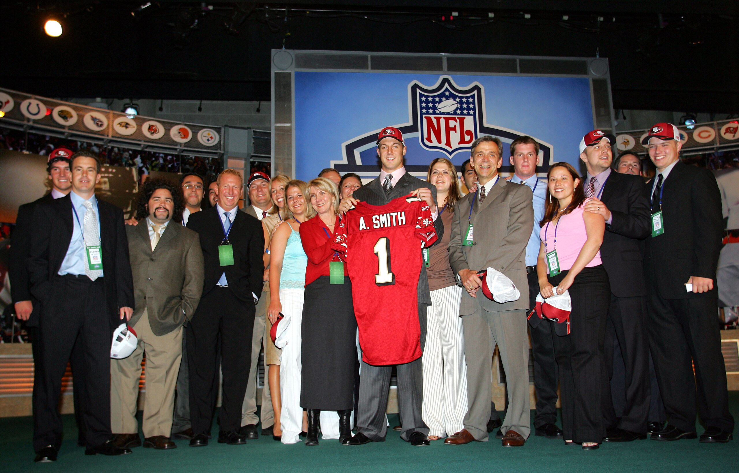NEW YORK - APRIL 23:  Quarterback Alex Smith (C) (Utah), drafted first overall by the San Francisco 49ers, poses with his family during the 70th NFL Draft on April 23, 2005 at the Jacob K. Javits Convention Center in New York City.  (Photo by Chris Trotma