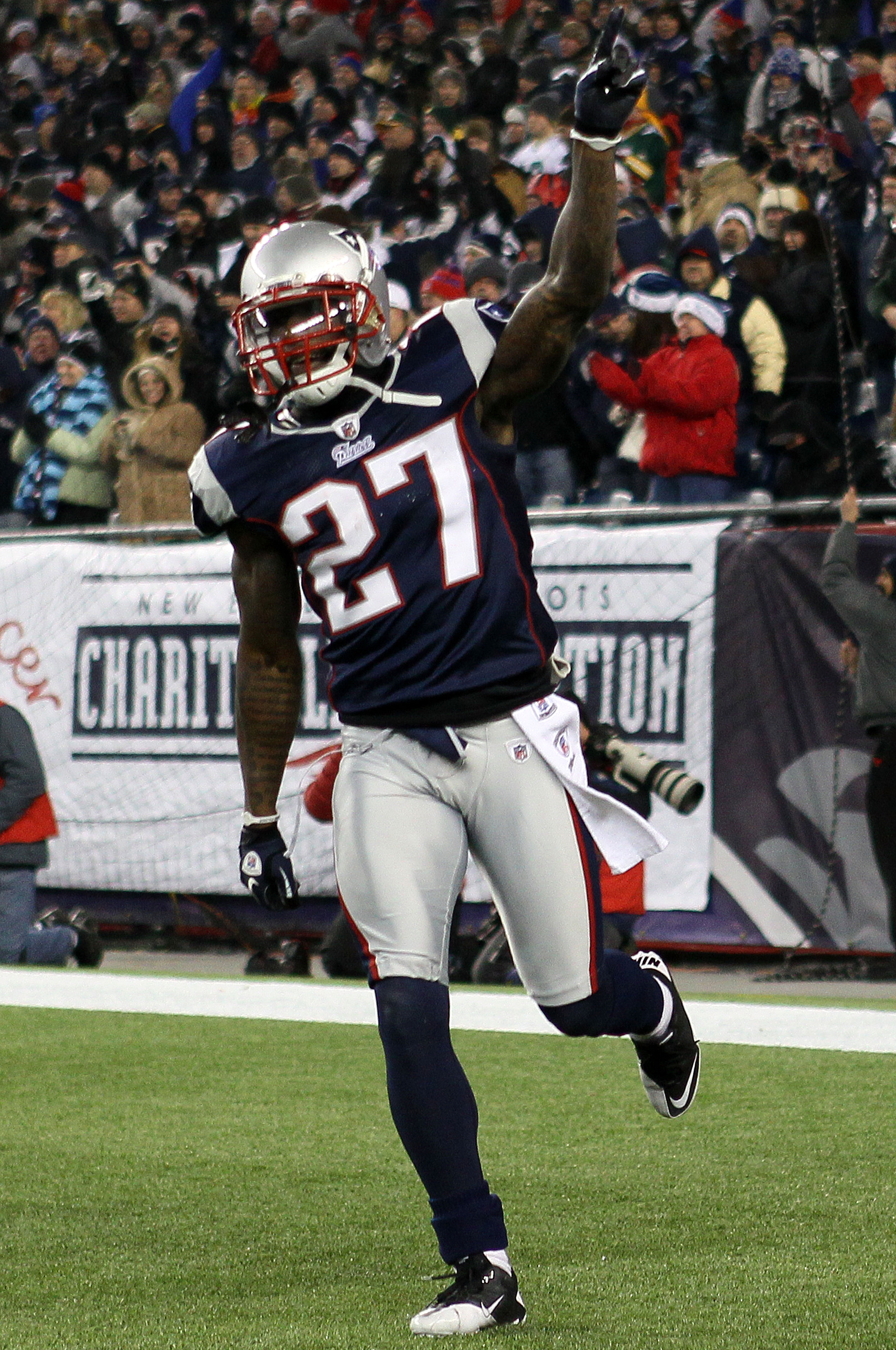 FOXBORO, MA - DECEMBER 19:  Cornerback Kyle Arrington #27 of the New England Patriots celebrates scoring a touchdown after intercepting the ball and running 36 yards against the Green Bay Packers during the third quarter of the game at Gillette Stadium on
