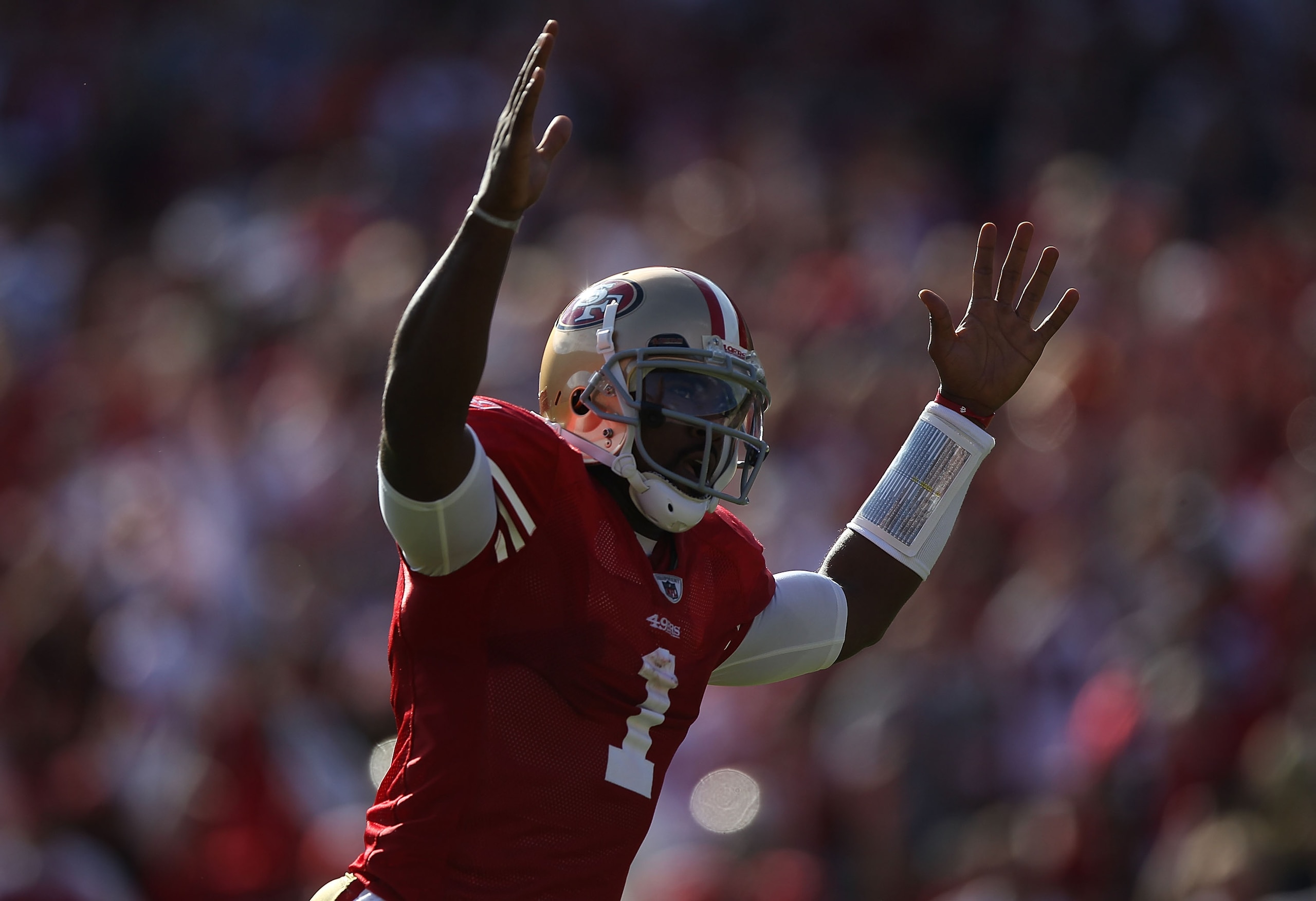 SAN FRANCISCO - NOVEMBER 14:  Troy Smith #1 of the San Francisco 49ers celebrates after a touchdown against the St. Louis Rams during an NFL game at Candlestick Park on November 14, 2010 in San Francisco, California.(Photo by Jed Jacobsohn/Getty Images)