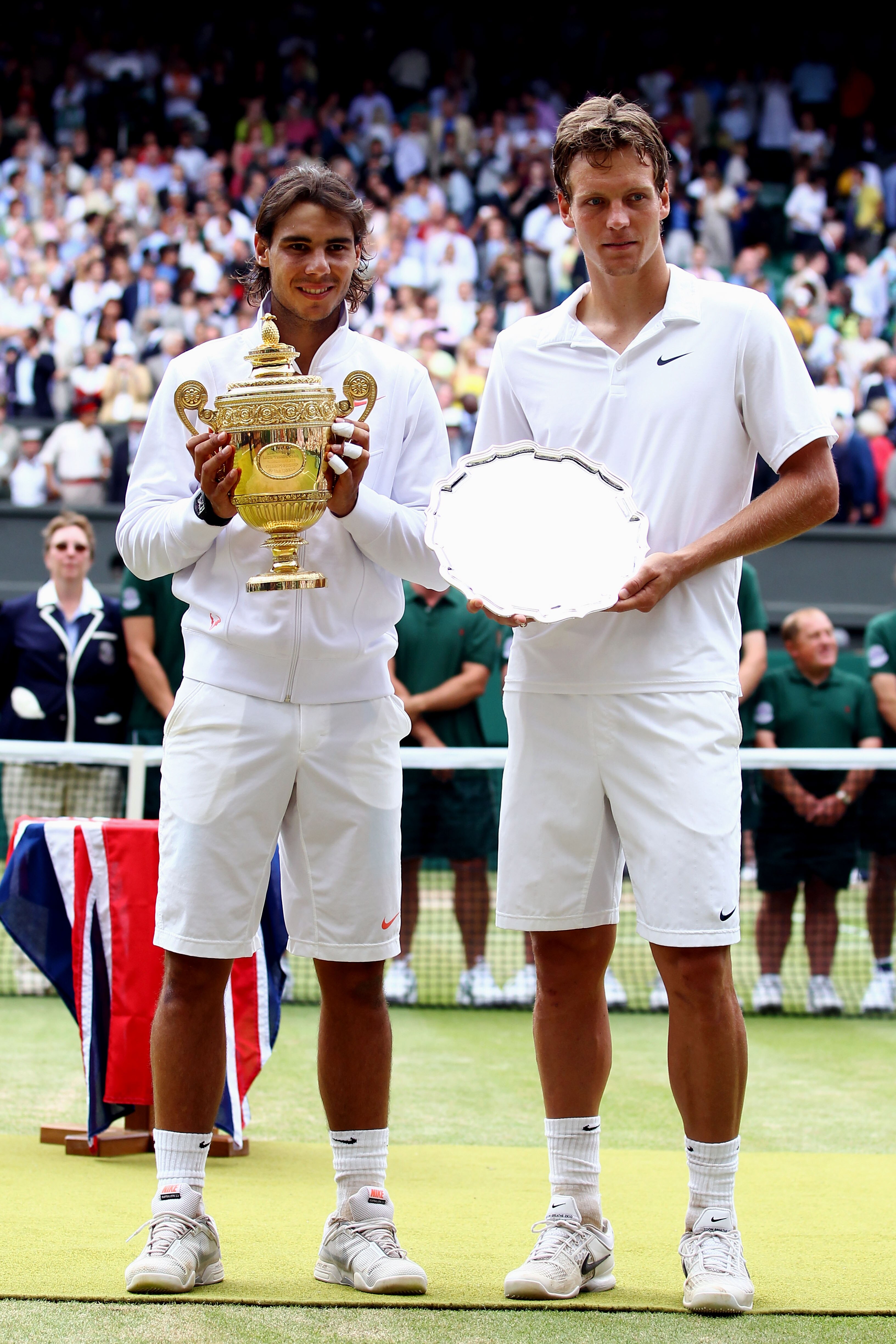 LONDON, ENGLAND - JULY 04:  Rafael Nadal of Spain (L) holds the Championship trophy after winning the Men's Singles Final match against Tomas Berdych of Czech Republic (R) on Day Thirteen of the Wimbledon Lawn Tennis Championships at the All England Lawn