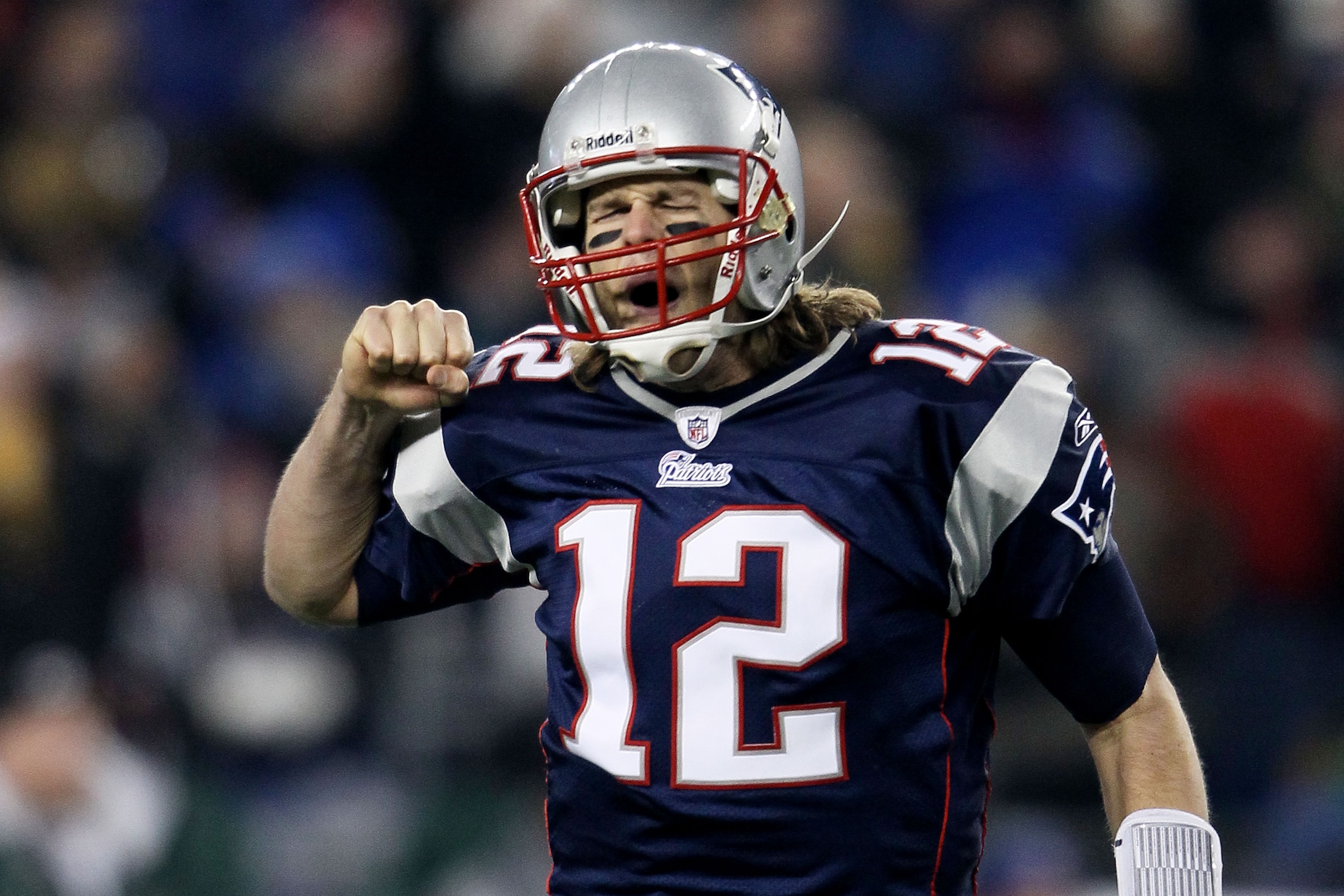 FOXBORO, MA - DECEMBER 19:  Quarterback Tom Brady #12 of the New England Patriots celebrates a touchdown scored by running back BenJarvus Green-Ellis #42 (not pictured) against the Green Bay Packers in the first quarter of the game at Gillette Stadium on 
