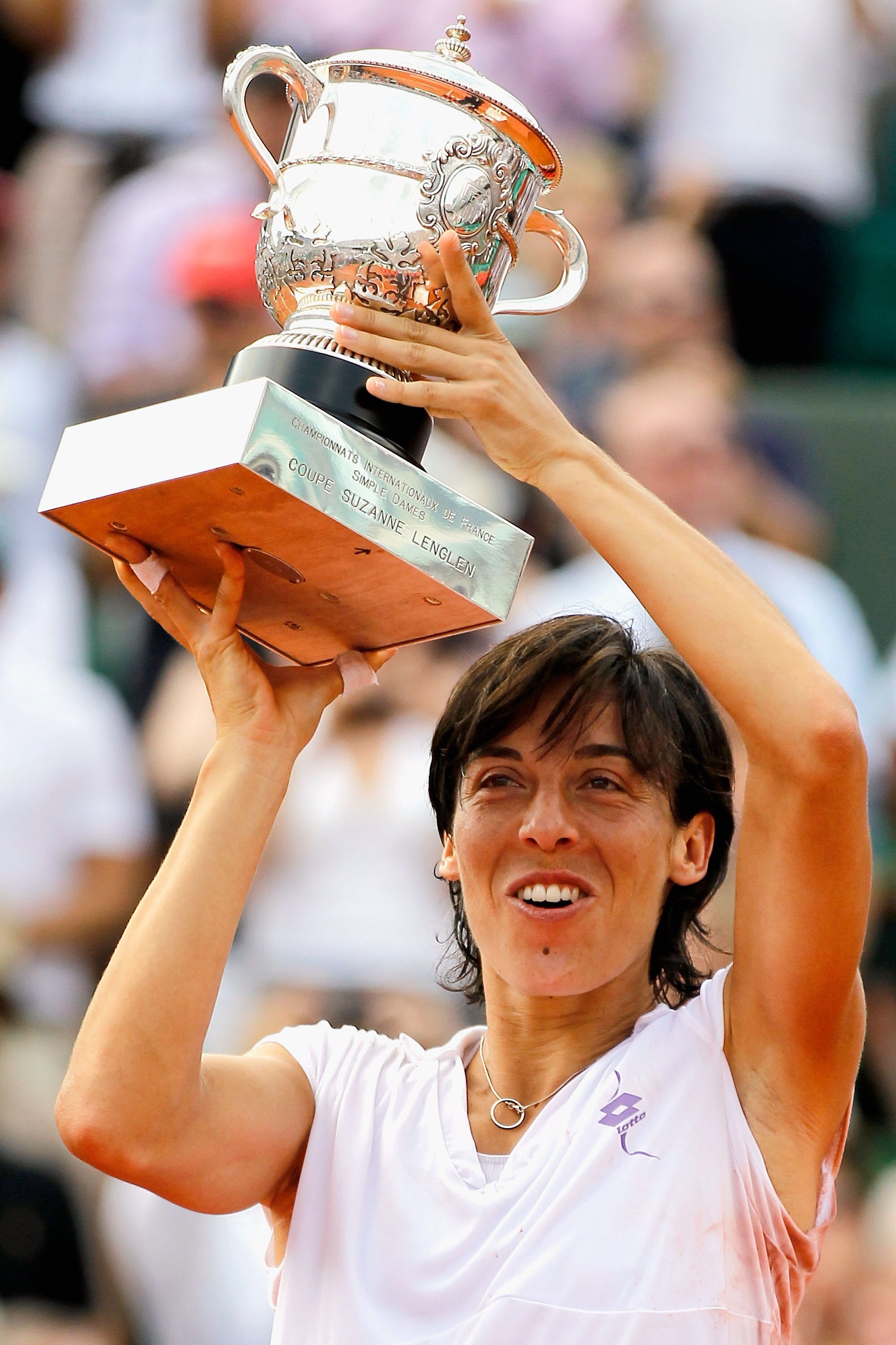 PARIS - JUNE 05:  Francesca Schiavone of Italy celebrates with the trophy after winning the women's singles final match between Francesca Schiavone of Italy and Samantha Stosur of Australia on day fourteen of the French Open at Roland Garros on June 5, 20