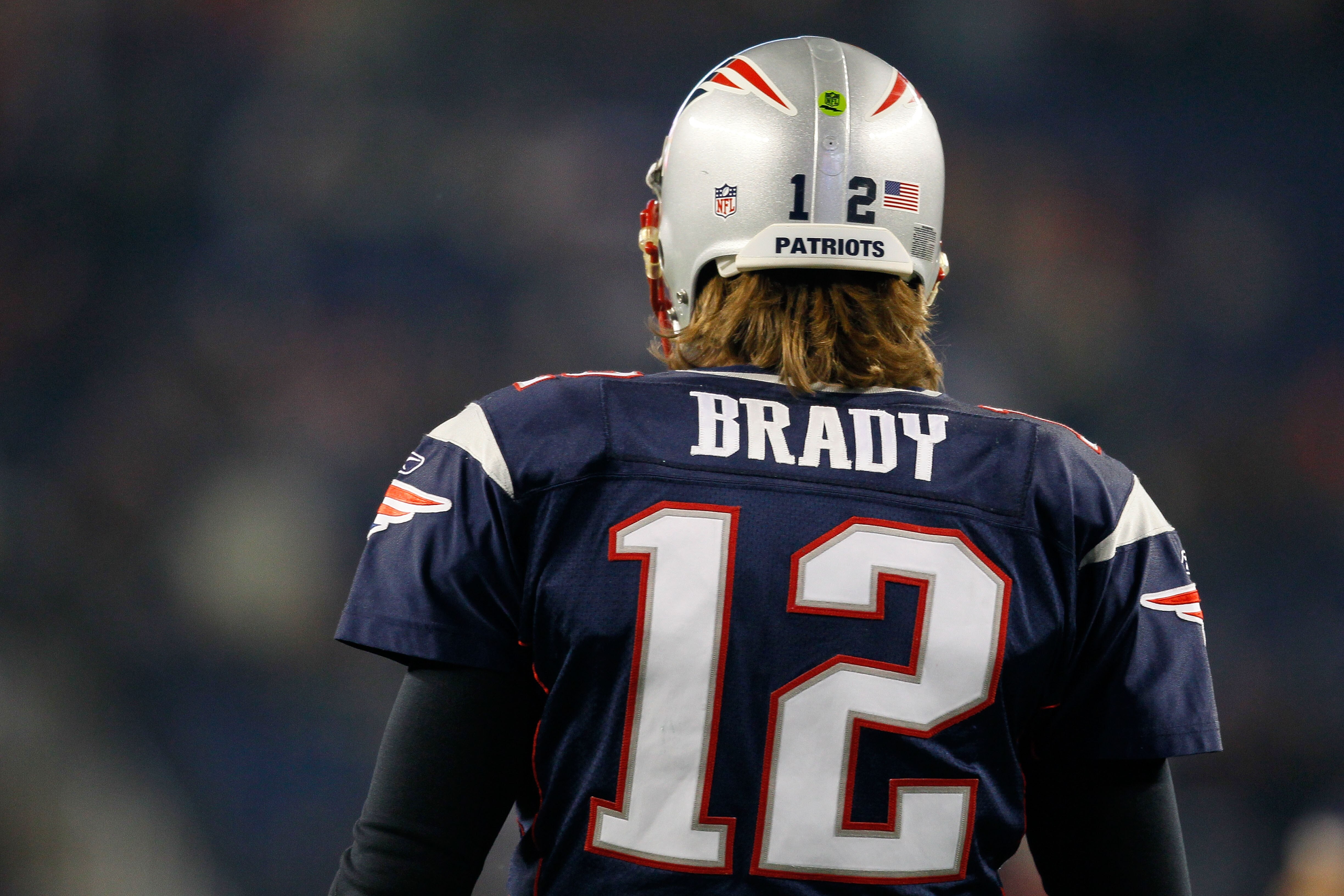 FOXBORO, MA - DECEMBER 19:  Quarterback Tom Brady #12 of the New England Patriots looks on during warm-ups before playing against the Green Bay Packers at Gillette Stadium on December 19, 2010 in Foxboro, Massachusetts.  (Photo by Jim Rogash/Getty Images)