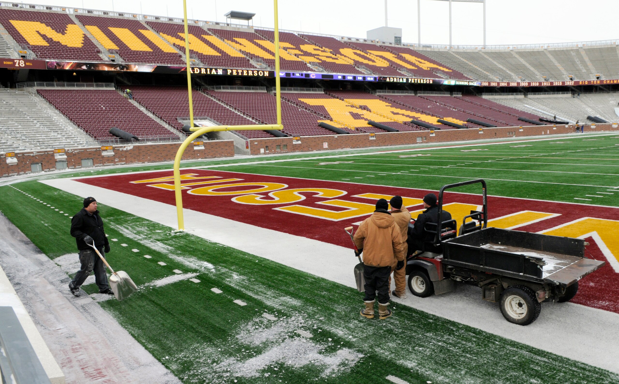 MINNEAPOLIS, MN - DECEMBER 17: Workers survey the playing field as TCF Bank Stadium prepares for a potential monday night football game between the Minnesota Vikings and Chicago Bears on December 17, 2010 in Minneapolis, Minnesota. Preparations are due to