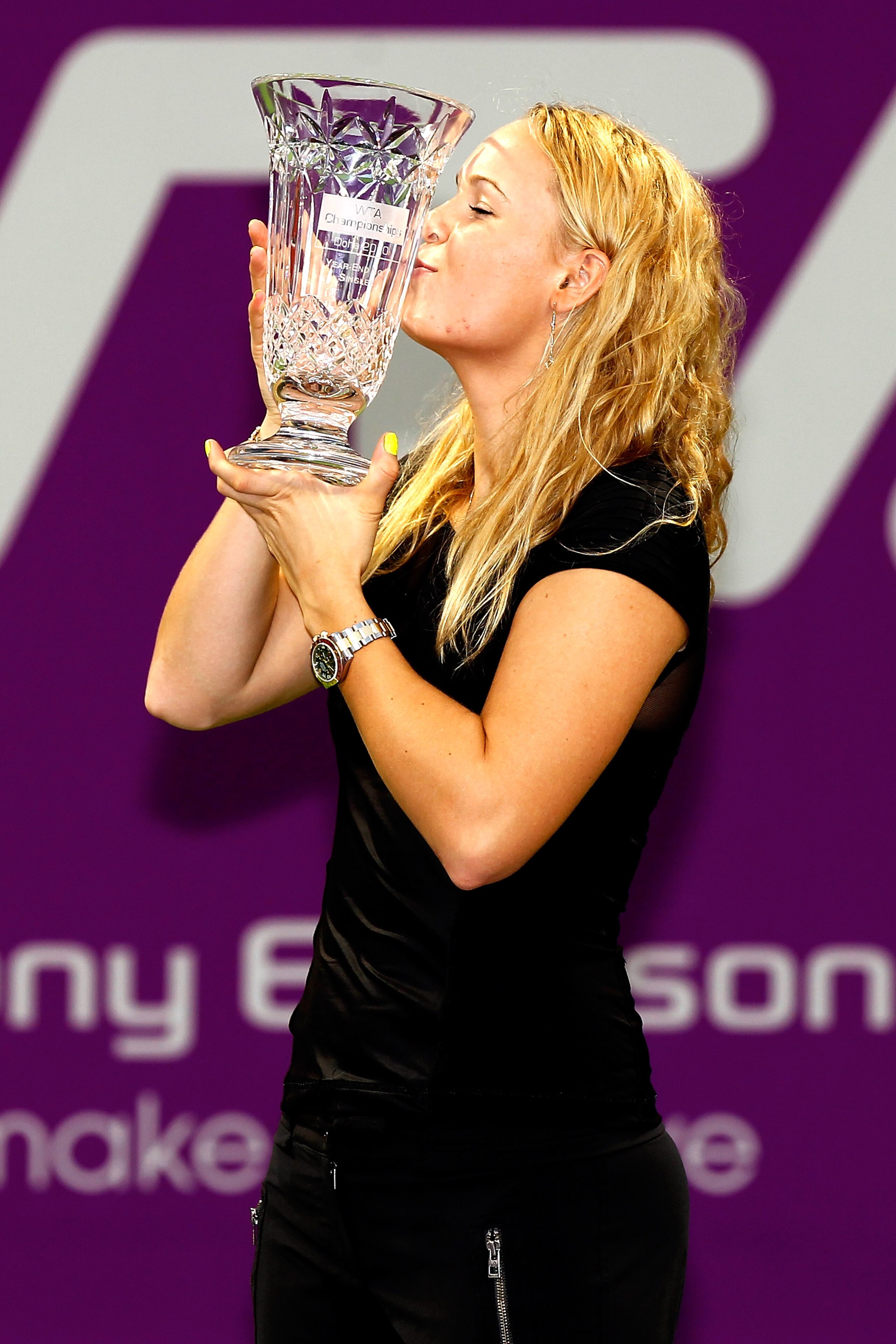DOHA, QATAR - OCTOBER 29:  Caroline Wozniacki of Denmark poses for photographers after receiving a trophy for finishing the year first in the WTA rankings during day four of the WTA Championships at the Khalifa Tennis Complex on October 29, 2010 in Doha,