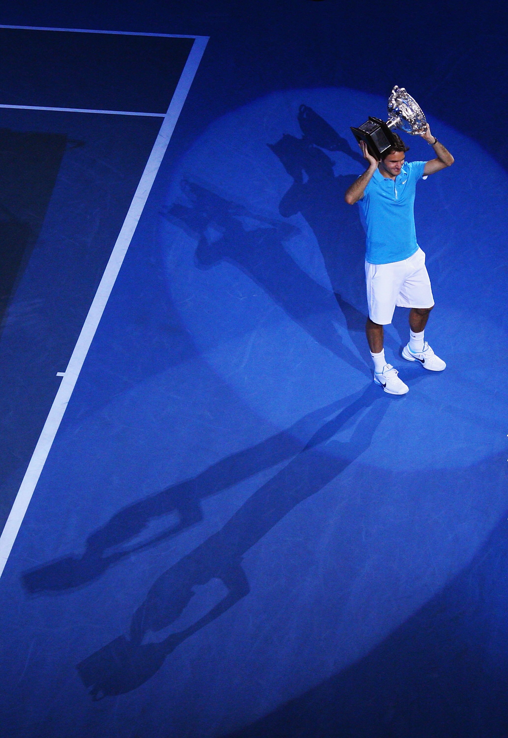 MELBOURNE, AUSTRALIA - JANUARY 31:  Roger Federer of Switzerland holds aloft the Norman Brookes Challenge Cup after his men's final match against Andy Murray of Great Britain during day fourteen of the 2010 Australian Open at Melbourne Park on January 31,