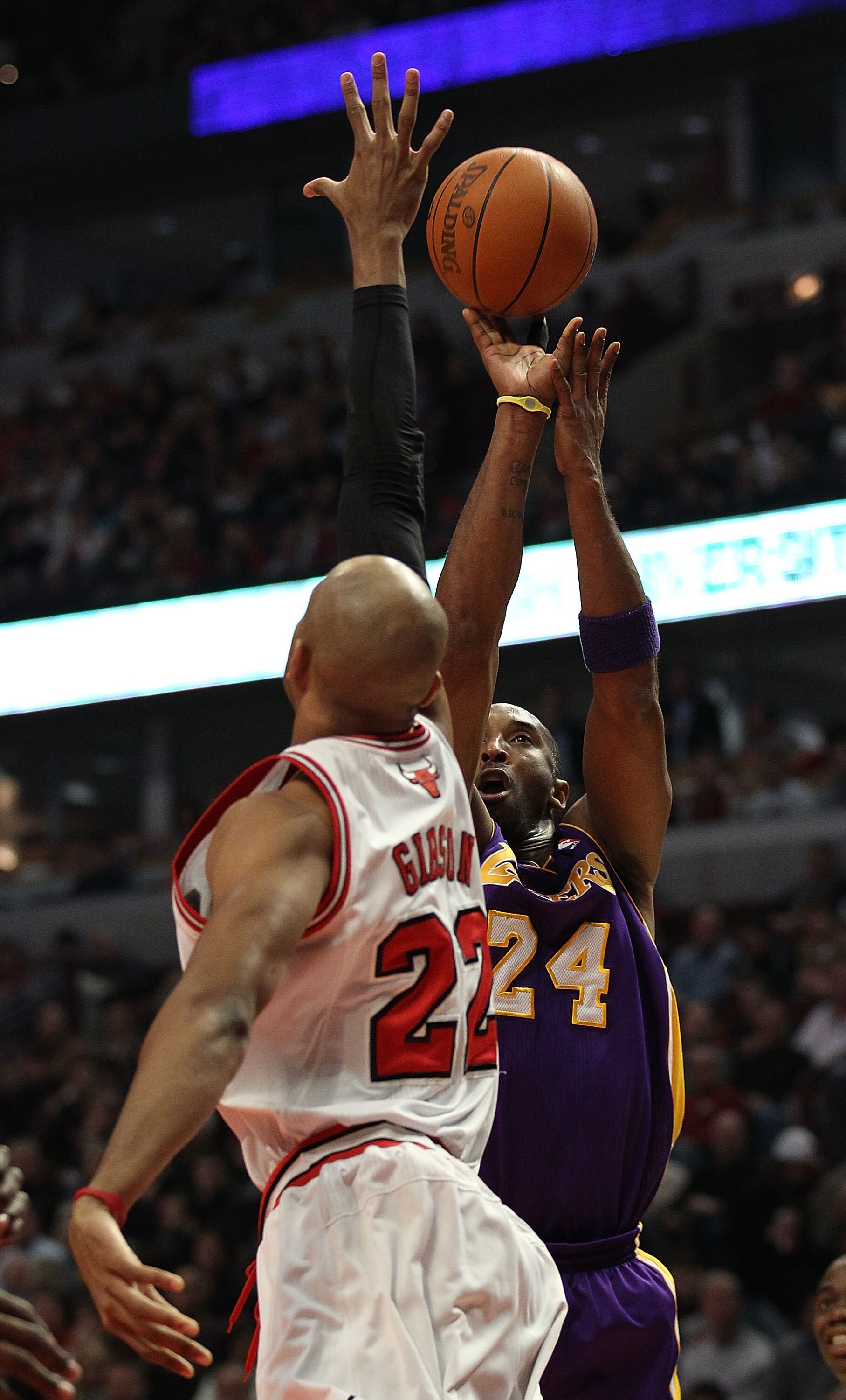 CHICAGO, IL - DECEMBER 10: Kobe Bryant #24 of the Los Angeles Lakers puts up a shot over Taj Gibson #22 of the Chicago Bulls at the United Center on December 10, 2010 in Chicago, Illinois. The Bulls defeated the Lakers 88-84. NOTE TO USER: User expressly 