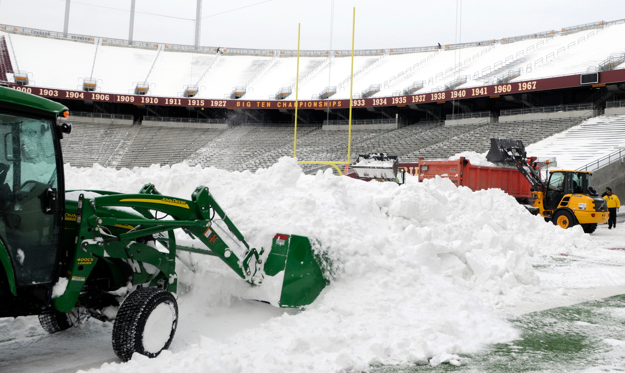 MINNEAPOLIS, MN - DECEMBER 15: Heavy machinery removes snow from the field as TCF Bank Stadium prepares for a potential monday night football game between the Minnesota Vikings and Chicago Bears on December 15, 2010 in Minneapolis, Minnesota. Preparations