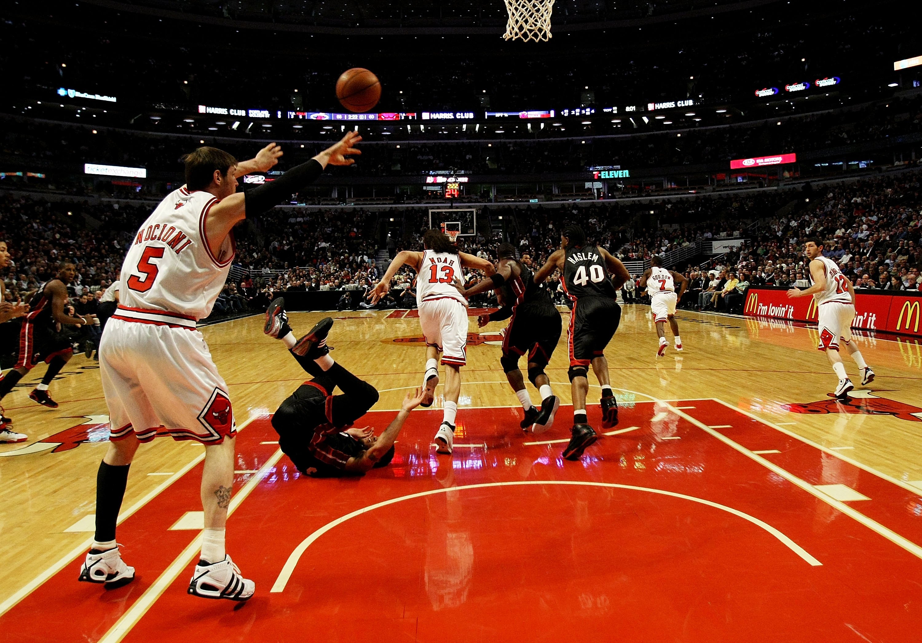 CHICAGO - FEBRUARY 12: Andres Nocioni #5 of the Chicago Bulls passes the ball after a steal from Michael Beasley #30 of the Miami Heat (on floor) on February 12, 2009 at the United Center in Chicago, Illinois. The Heat defeated the Bulls 95-93. NOTE TO US