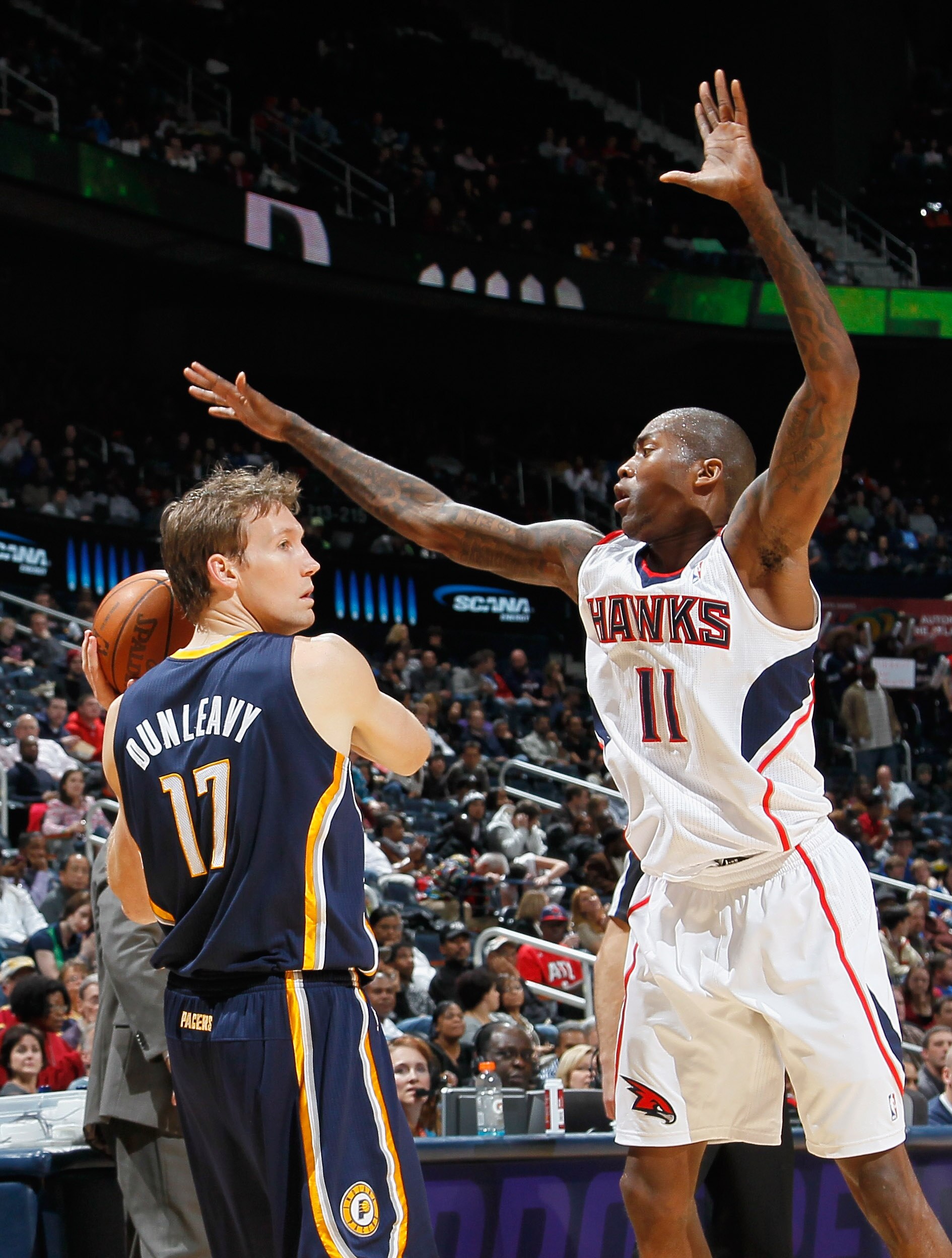 ATLANTA, GA - DECEMBER 11:  Jamal Crawford #11 of the Atlanta Hawks defends against Mike Dunleavy #17 of the Indiana Pacers at Philips Arena on December 11, 2010 in Atlanta, Georgia.  NOTE TO USER: User expressly acknowledges and agrees that, by downloadi
