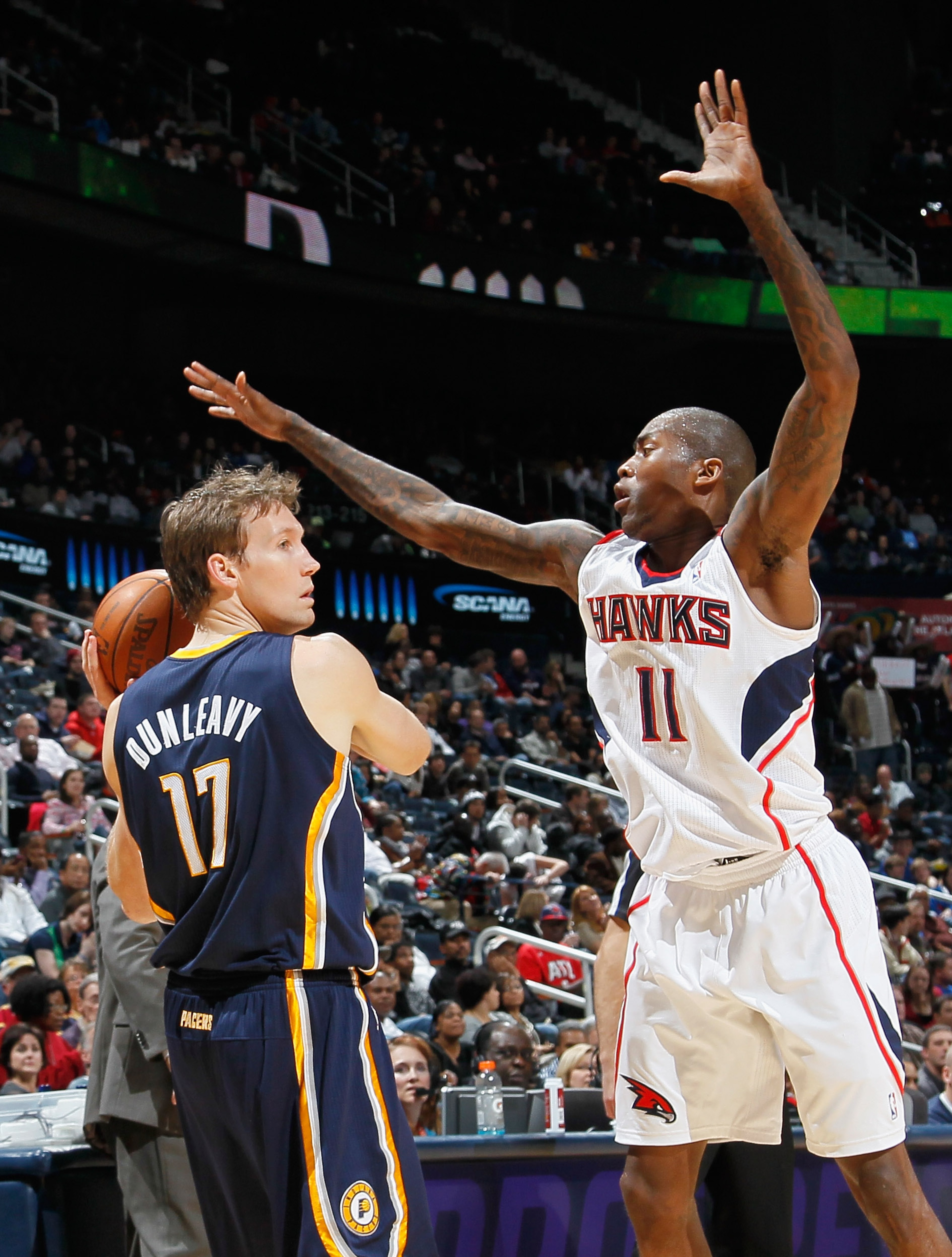 ATLANTA, GA - DECEMBER 11:  Jamal Crawford #11 of the Atlanta Hawks defends against Mike Dunleavy #17 of the Indiana Pacers at Philips Arena on December 11, 2010 in Atlanta, Georgia.  NOTE TO USER: User expressly acknowledges and agrees that, by downloadi