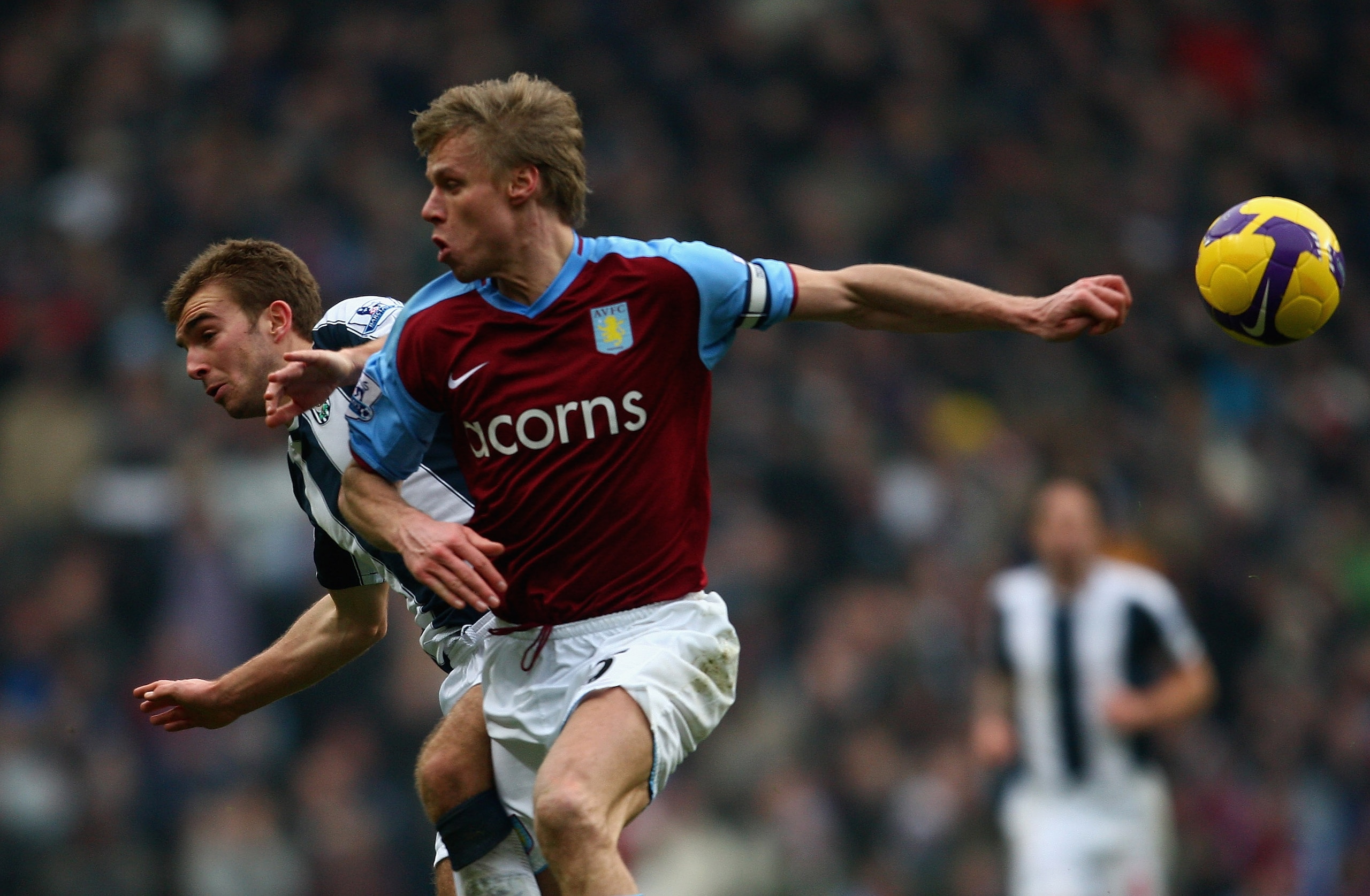 BIRMINGHAM, UNITED KINGDOM - JANUARY 10:  Martin Laursen of Aston Villa battles with James Morrison of West Bromwich Albion during the Barclays Premier League match between Aston Villa and West Bromwich Albion at Villa Park on January 10, 2009 in Birmingh