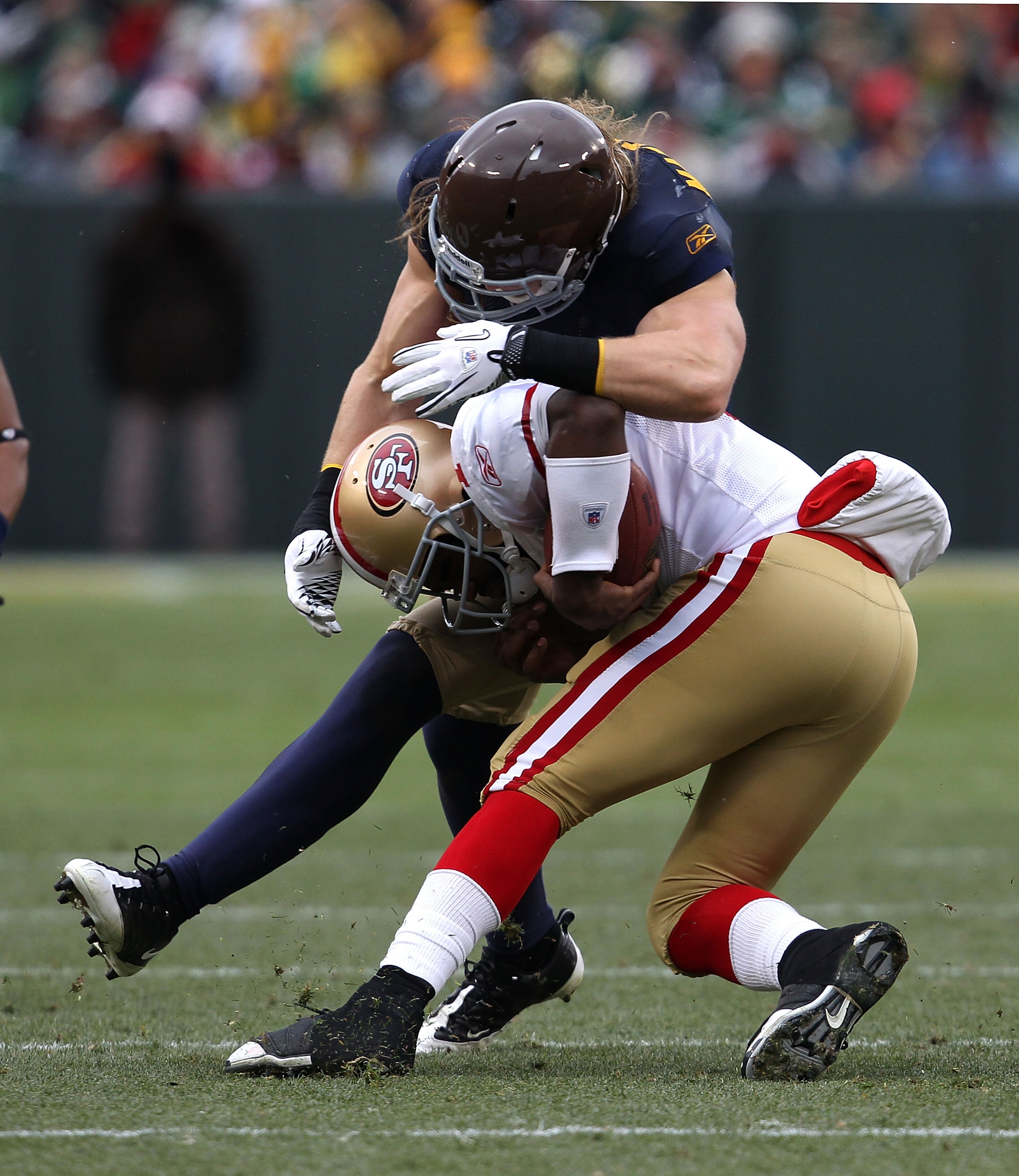 GREEN BAY, WI - DECEMBER 05: Troy Smith #1 of the San Francisco 49ers is tackled by Clay Matthews #52 of the Green Bay Packers at Lambeau Field on December 5, 2010 in Green Bay, Wisconsin. The Packers defeated the 49ers 34-16. (Photo by Jonathan Daniel/Ge GREEN BAY, WI - DECEMBER 05: Troy Smith #1 of the San Francisco 49ers is tackled by Clay Matthews #52 of the Green Bay Packers at Lambeau Field on December 5, 2010 in Green Bay, Wisconsin. The Packers defeated the 49ers 34-16. (Photo by Jonathan Daniel/Ge