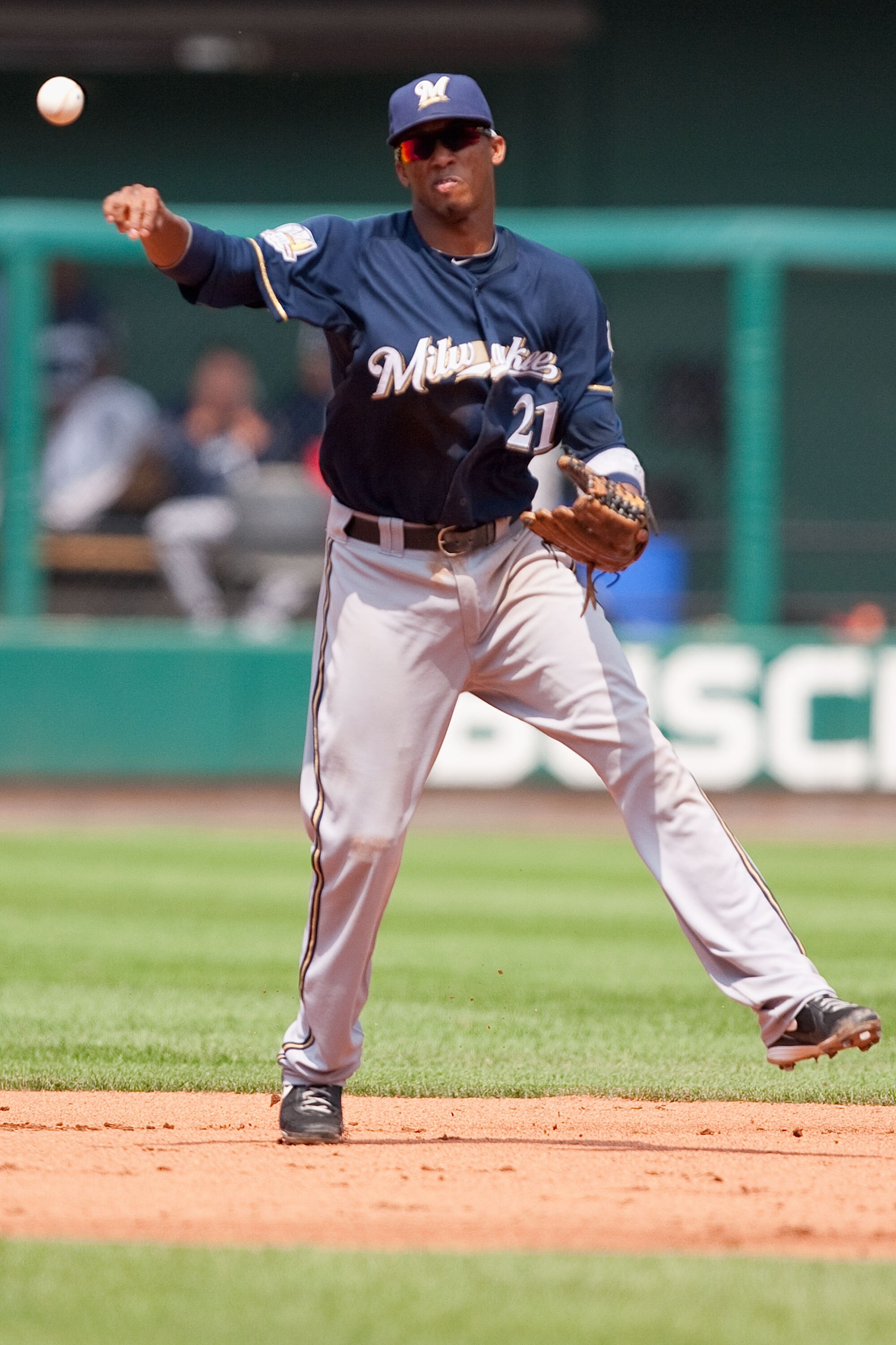 ST. LOUIS - AUGUST 18: Alcides Escobar #21 of the Milwaukee Brewers throws to first base against the St. Louis Cardinals at Busch Stadium on August 18, 2010 in St. Louis, Missouri.  The Brewers beat the Cardinals 3-2.  (Photo by Dilip Vishwanat/Getty Imag