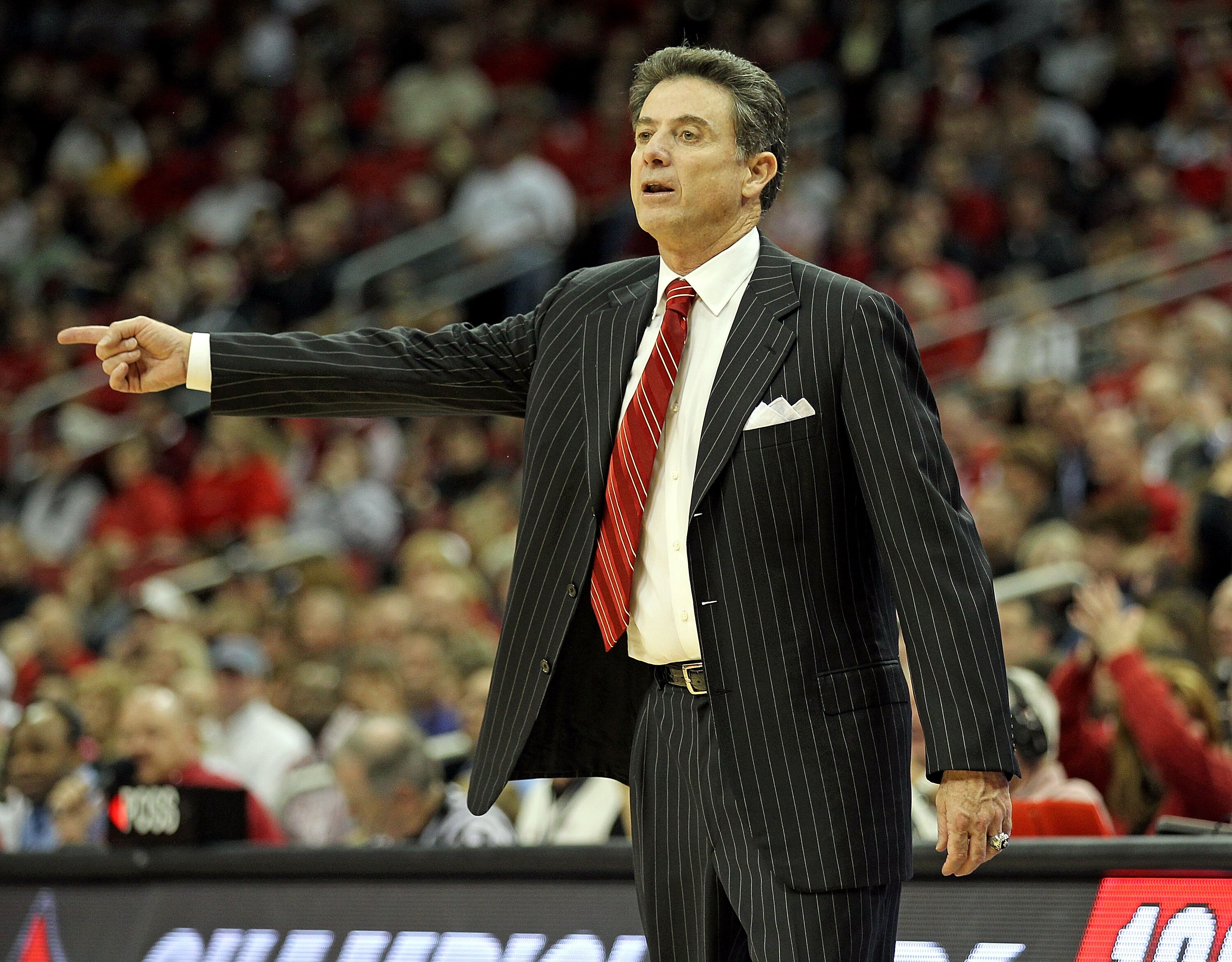 LOUISVILLE, KY - NOVEMBER 22:  Rick Pitino the Head Coach of the Louisville Cardinals gives instructions to his team during the game against  Chattanooga Mocs at the KFC Yum! CENTER on November 22, 2010 in Louisville, Kentucky.  Louisville won 106-65.  (P