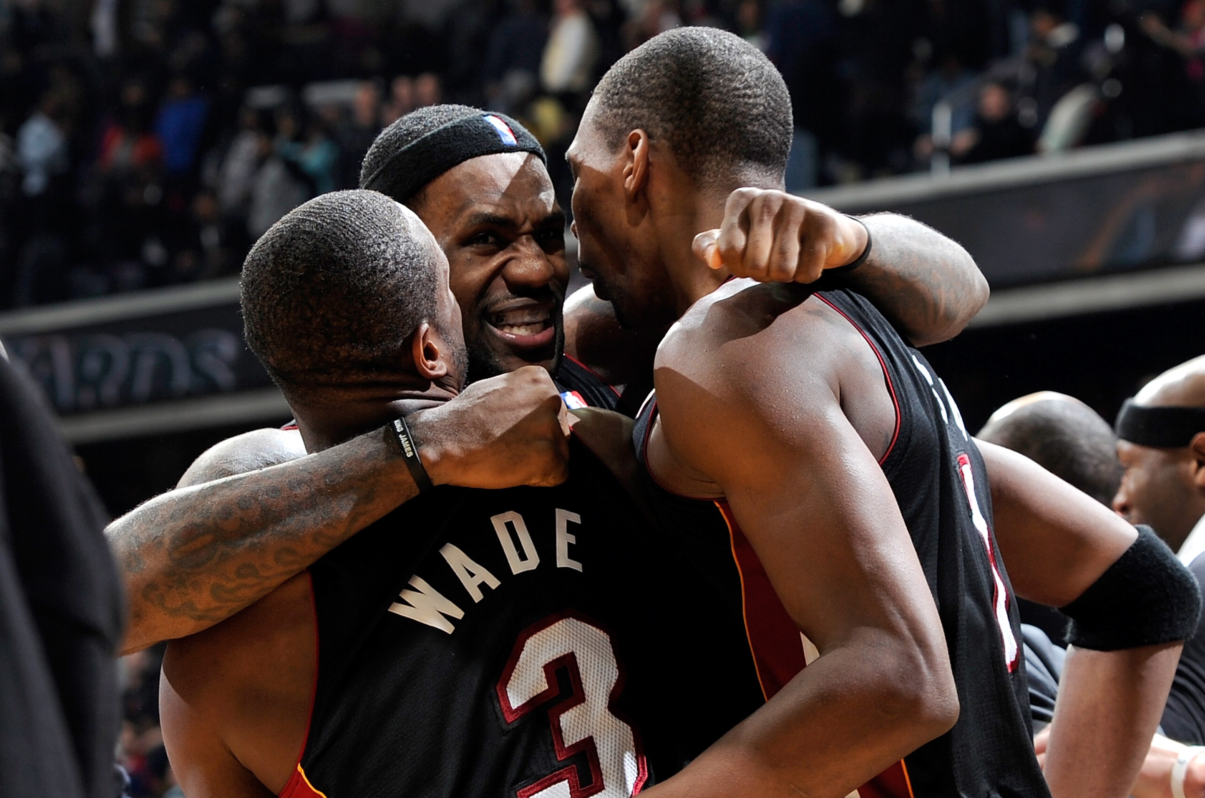 WASHINGTON - DECEMBER 18: LeBron James #6 of the Miami Heat celebrates with Dwyane Wade #3 and Chris Bosh #1 after a 95-94 victory over the Washington Wizards at the Verizon Center on December 18, 2010 in Washington, DC. NOTE TO USER: User expressly ackn WASHINGTON - DECEMBER 18: LeBron James #6 of the Miami Heat celebrates with Dwyane Wade #3 and Chris Bosh #1 after a 95-94 victory over the Washington Wizards at the Verizon Center on December 18, 2010 in Washington, DC. NOTE TO USER: User expressly ackn