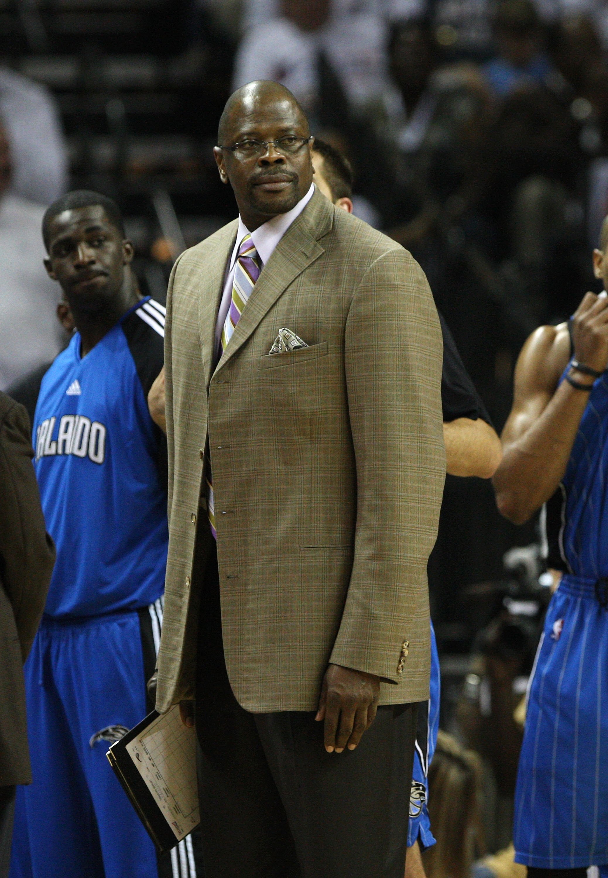 CHARLOTTE - APRIL 24:  Assistant coach Patrick Ewing (C) of the Orlando Magic looks at the referee (not pictured) during a timeout in Game Three of the Eastern Conference Quarterfinals against the Charlotte Bobcats during the 2010 NBA Playoffs at Time War