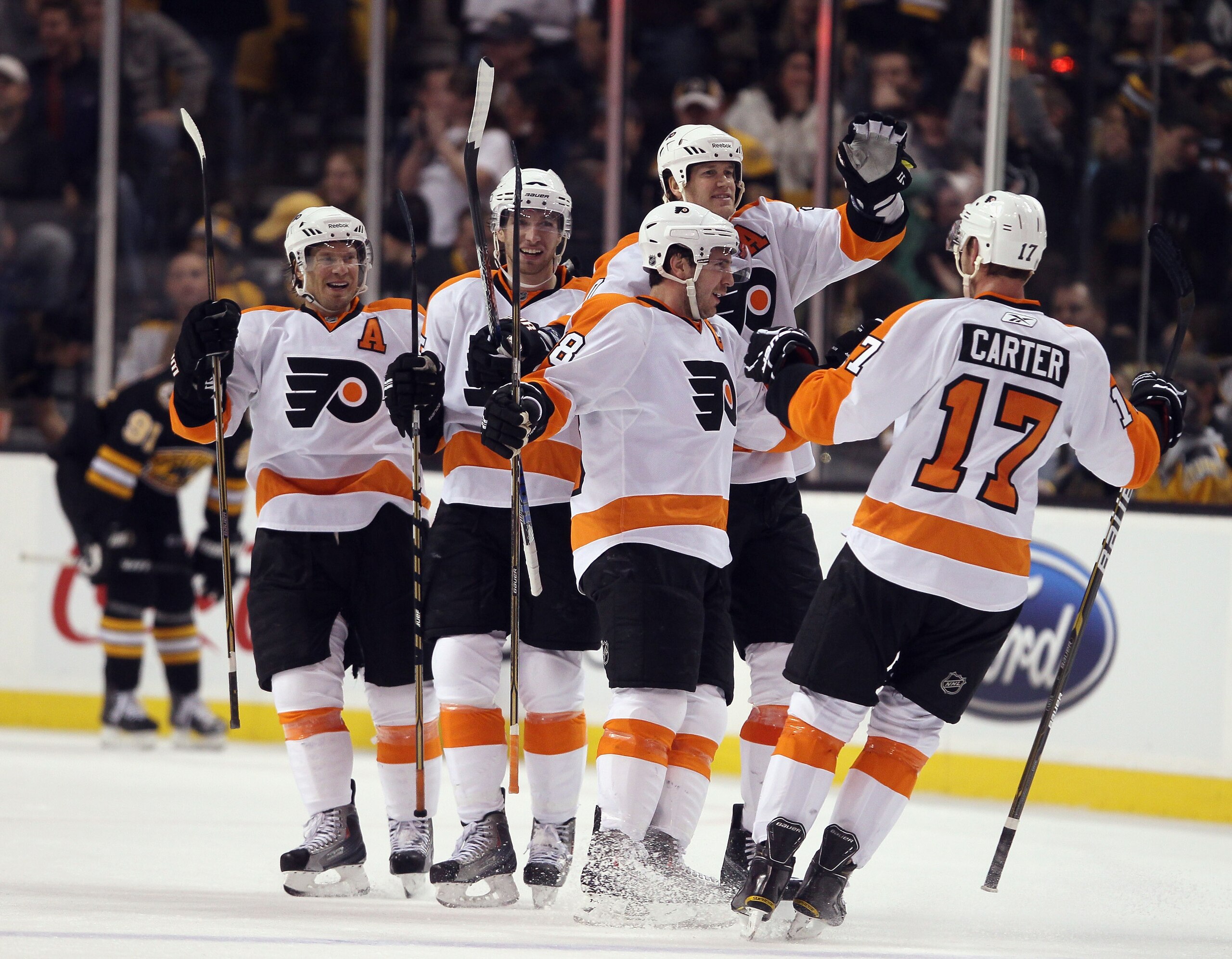 BOSTON, MA - DECEMBER 11: Mike Richards #18 of the Philadelphia Flyers is congratulated by teammates Chris Pronger #20, Andreas Nodl #15, Kimmo Timonen #44 and Jeff Carter #17 after Richards scored the game winning goal in overtime against the Boston Bru BOSTON, MA - DECEMBER 11: Mike Richards #18 of the Philadelphia Flyers is congratulated by teammates Chris Pronger #20, Andreas Nodl #15, Kimmo Timonen #44 and Jeff Carter #17 after Richards scored the game winning goal in overtime against the Boston Bru