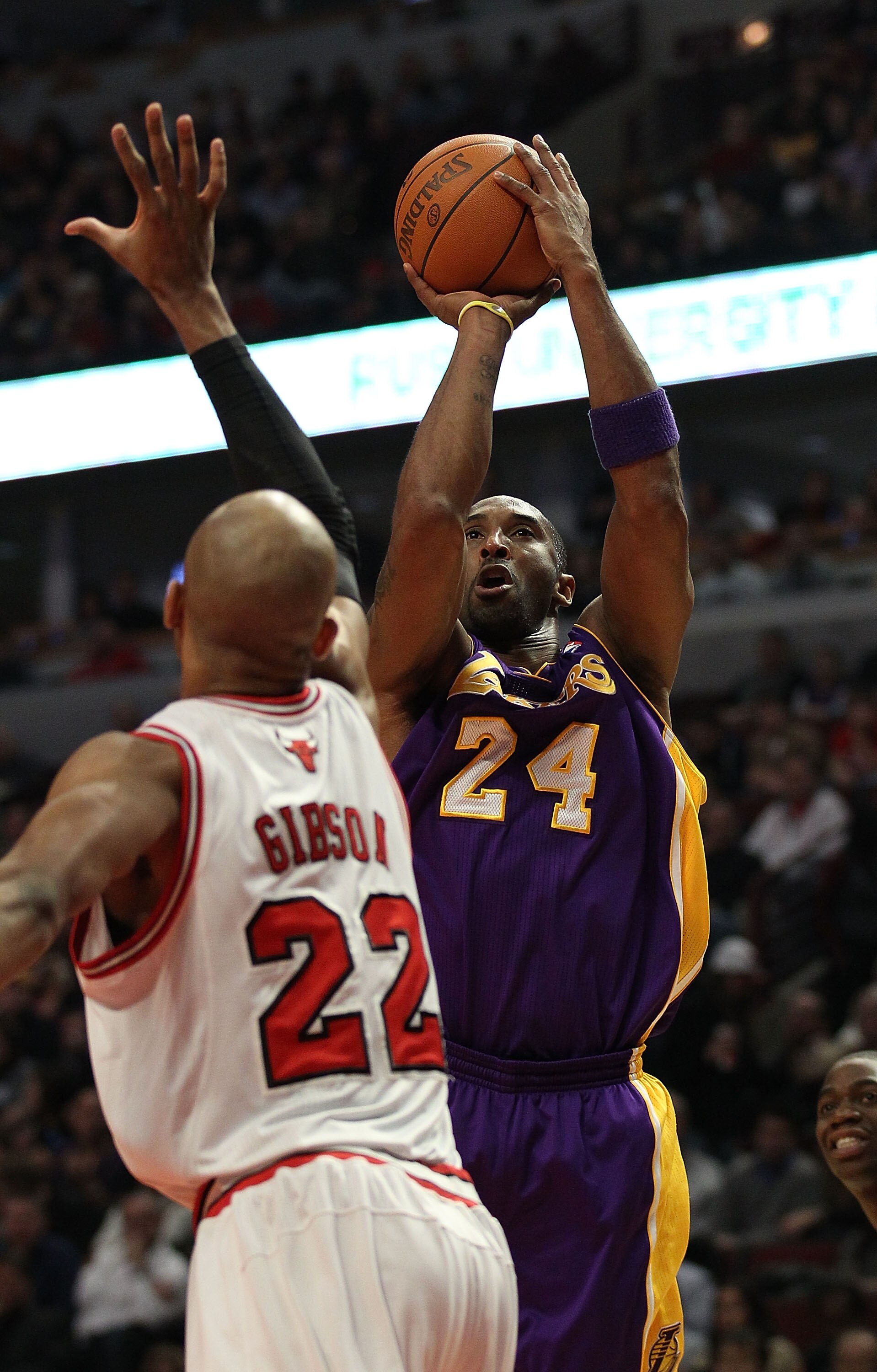 CHICAGO, IL - DECEMBER 10: Kobe Bryant #24 of the Los Angeles Lakers puts up a shot over Taj Gibson #22 of the Chicago Bulls at the United Center on December 10, 2010 in Chicago, Illinois. The Bulls defeated the Lakers 88-84. NOTE TO USER: User expressly 