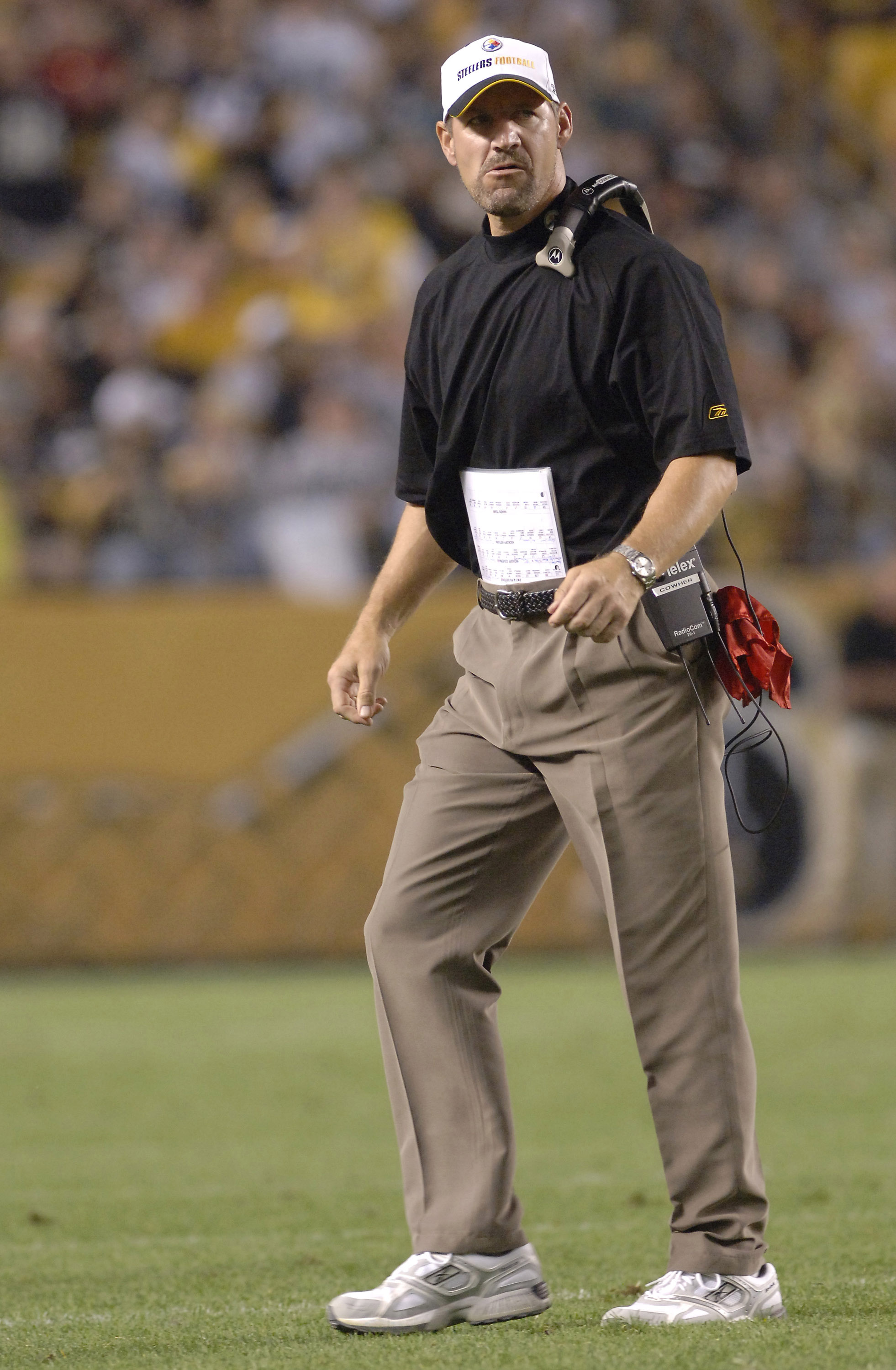 Pittsburgh Steelers coach Bill Cowher walks onto the field versus the Miami Dolphins at Heinz Field in Pittsburgh. The Steelers won 28-17.  (Photo by Al Messerschmidt/Getty Images)