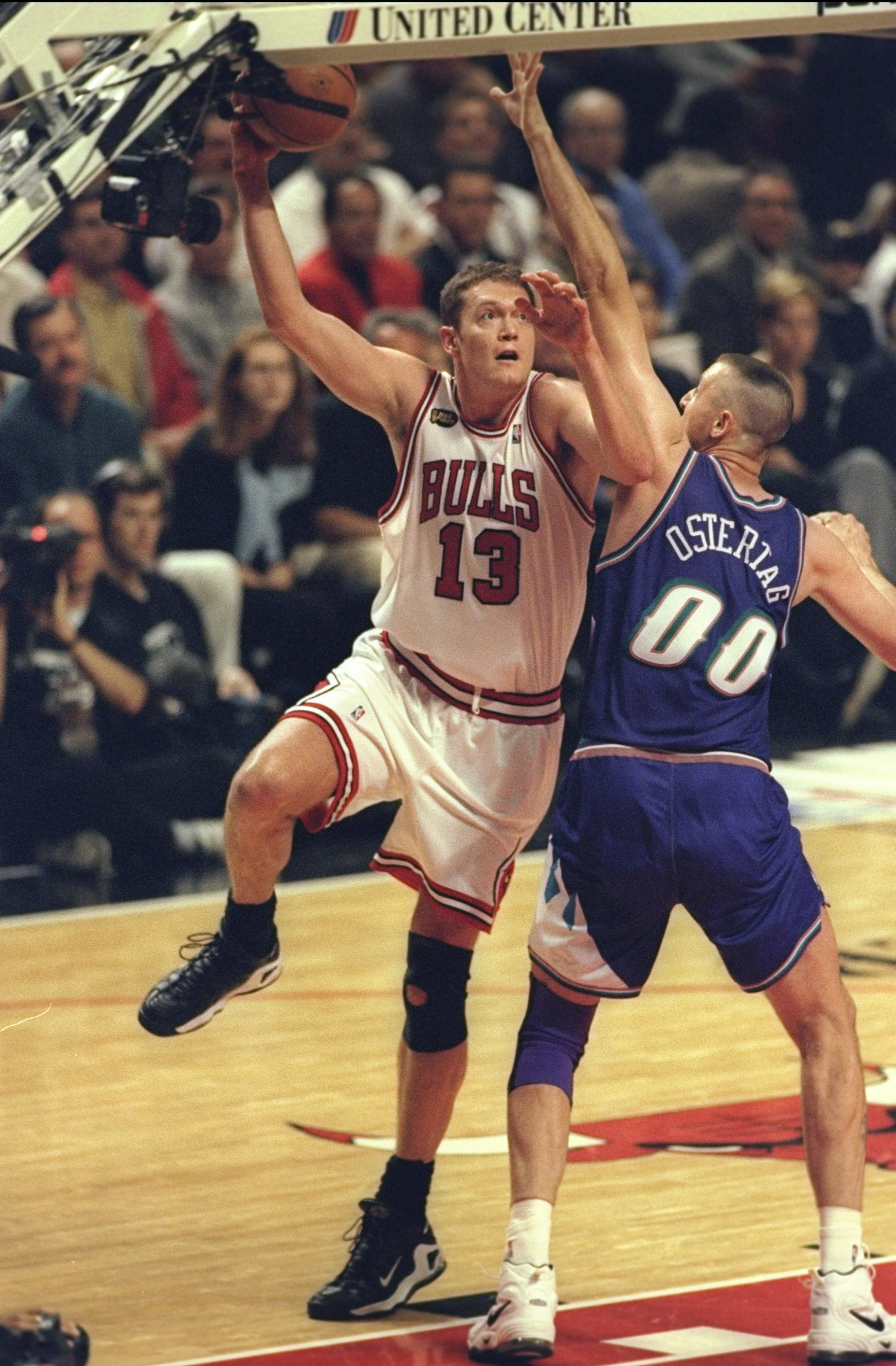 7 Jun 1998:  Luc Longley #13 of the Chicago Bulls in action against Greg Ostertag #00 of the Utah Jazz during the NBA Finals Game 3 at the United Center in Chicago, Illinois.  The Bulls defeated the Jazz 96-54. Mandatory Credit: Jonathan Daniel/Allsport