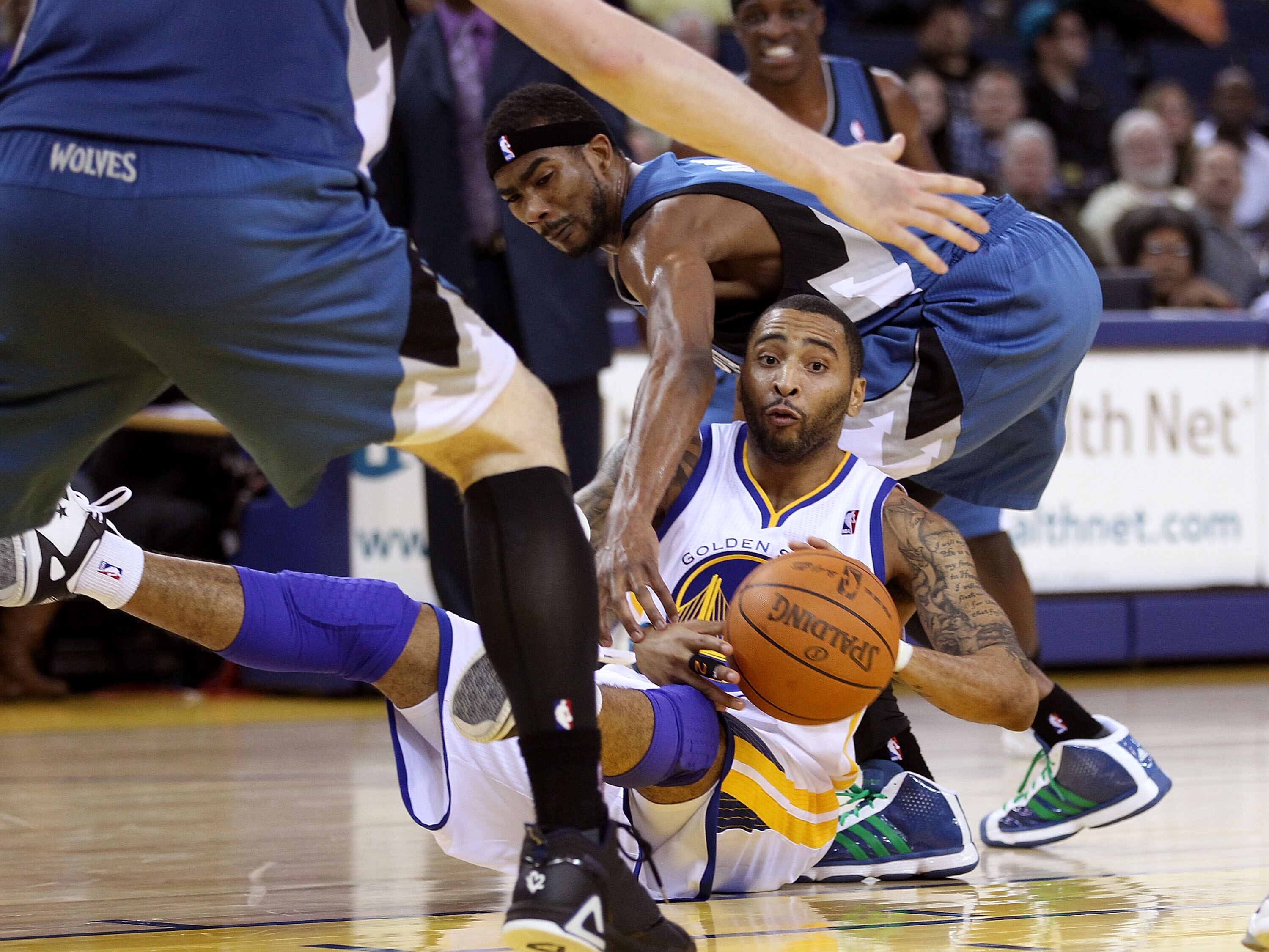 OAKLAND, CA - DECEMBER 14:  Corey Brewer #22 of the Minnesota Timberwolves tries to steal the ball from Acie Law #2 of the Golden State Warriors at Oracle Arena on December 14, 2010 in Oakland, California.  NOTE TO USER: User expressly acknowledges and ag