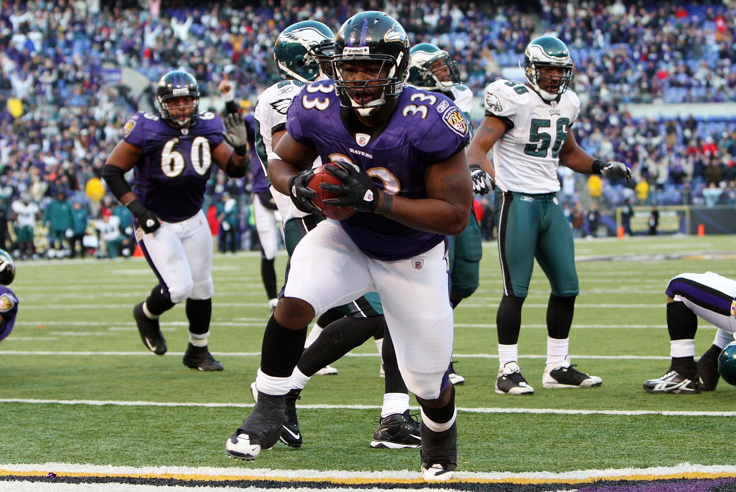 BALTIMORE - NOVEMBER 23:  LeRon McClain #33 of the Baltimore Ravens carries the ball into the endzone for a touchdown against the Philadelphia Eagles on November 23, 2008 at M&T Bank Stadium in Baltimore, Maryland. The Ravens defeated the Eagles 36-7.  (P