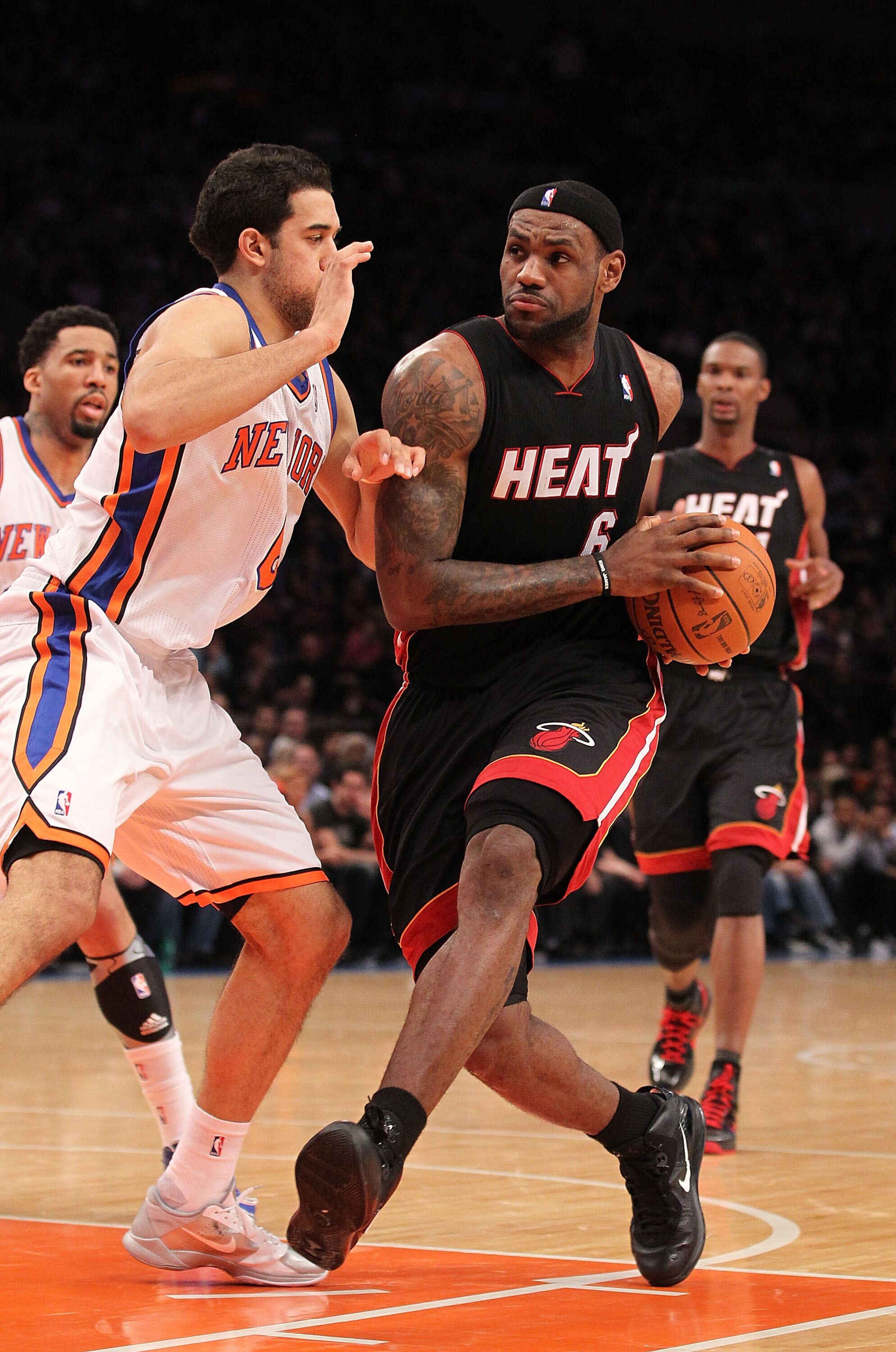 NEW YORK - DECEMBER 17:  LeBron James #6 of the Miami Heat drives to the basket against Danilo Gallinari #8 of the New York Knicks at Madison Square Garden on December 17, 2010 in New York City. NOTE TO USER: User expressly acknowledges and agrees that, b