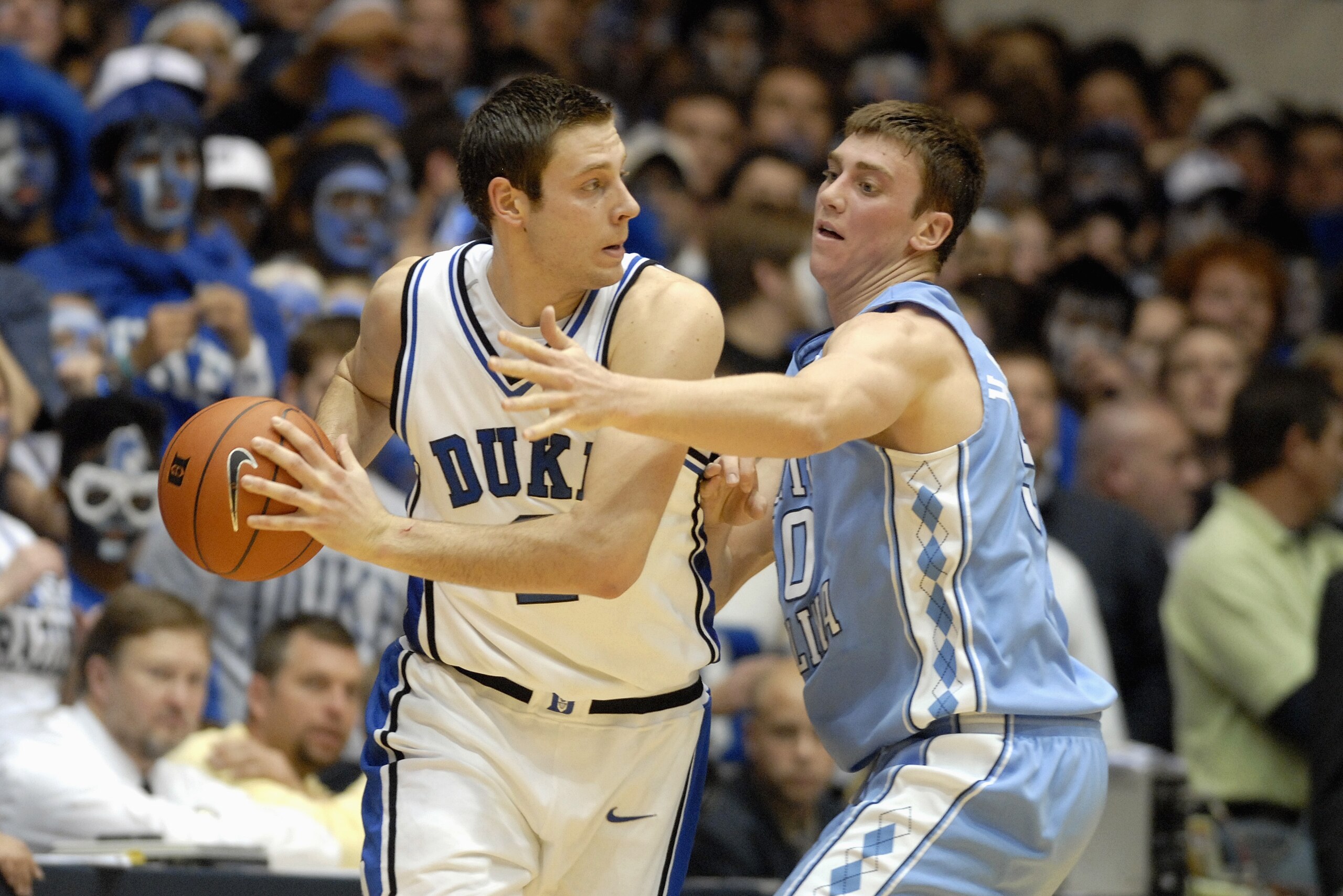 DURHAM, NC - FEBRUARY 7: Josh McRoberts #2 of the Duke University Blue Devils looks to move the ball against Tyler Hansbrough #50 of the North Carolina Tar Heels during the game on February 7, 2007 at Cameron Indoor Stadium in Durham, N.C. North Carolina