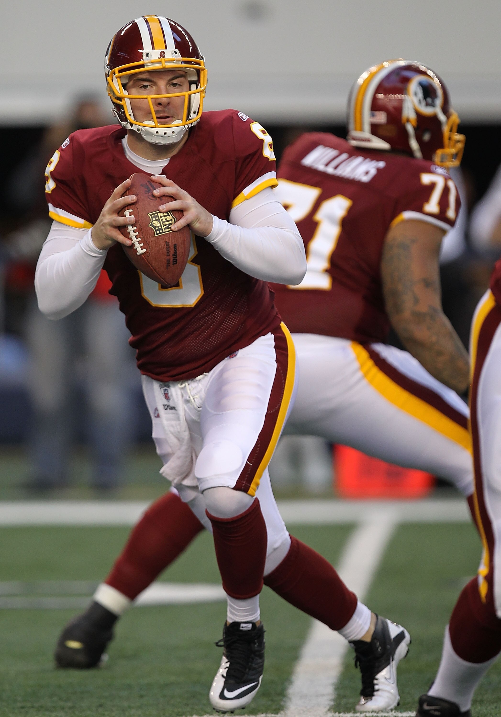 ARLINGTON, TX - DECEMBER 19:  Quarterback Rex Grossman #8 of the Washington Redskins passes against the Dallas Cowboys at Cowboys Stadium on December 19, 2010 in Arlington, Texas.  (Photo by Ronald Martinez/Getty Images)