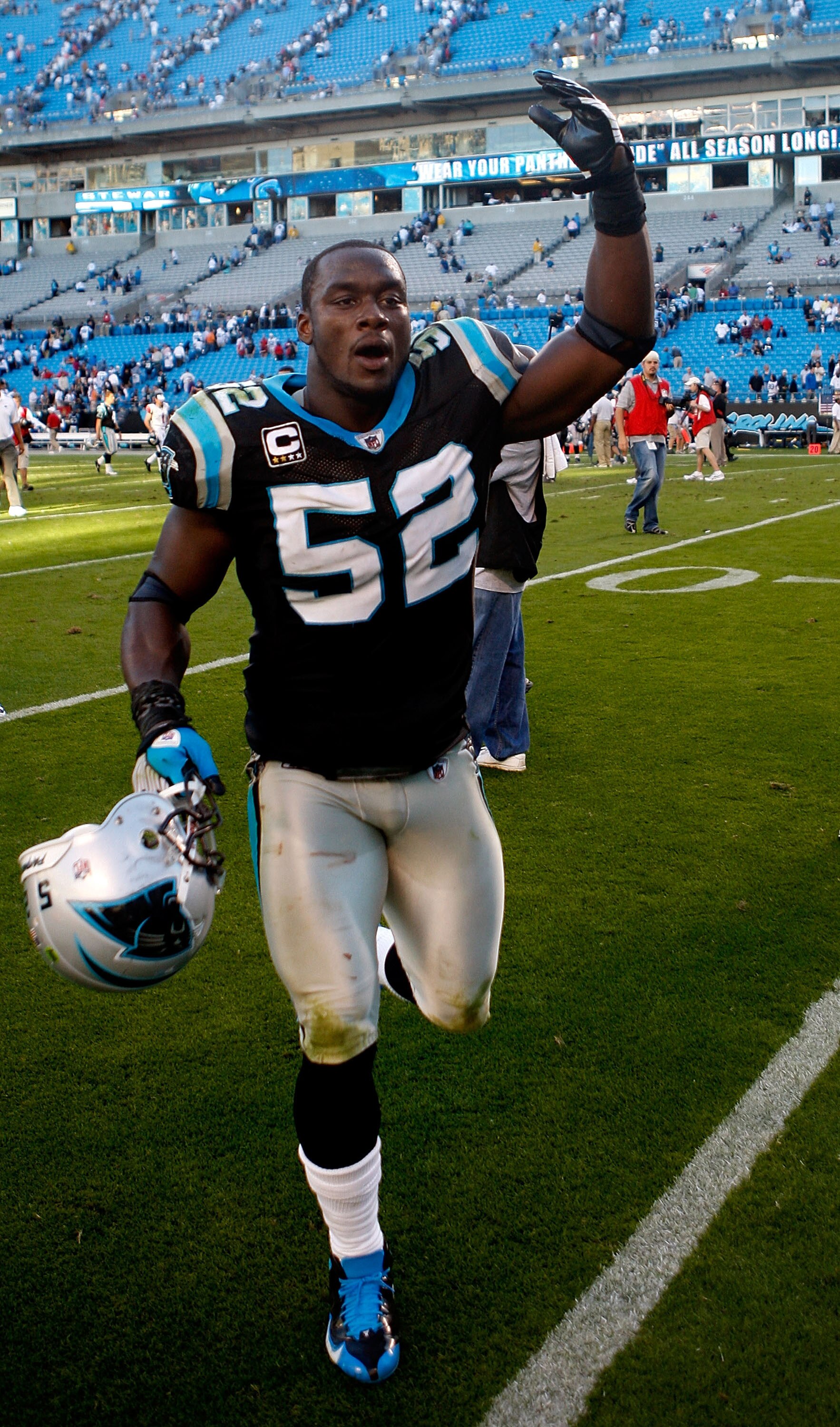 CHARLOTTE, NC - NOVEMBER 15:  Jon Beason #52 of the Carolina Panthers celebrates a 28-19 against the Atlanta Falcons during their game at Bank of America Stadium on November 15, 2009 in Charlotte, North Carolina.  (Photo by Streeter Lecka/Getty Images)